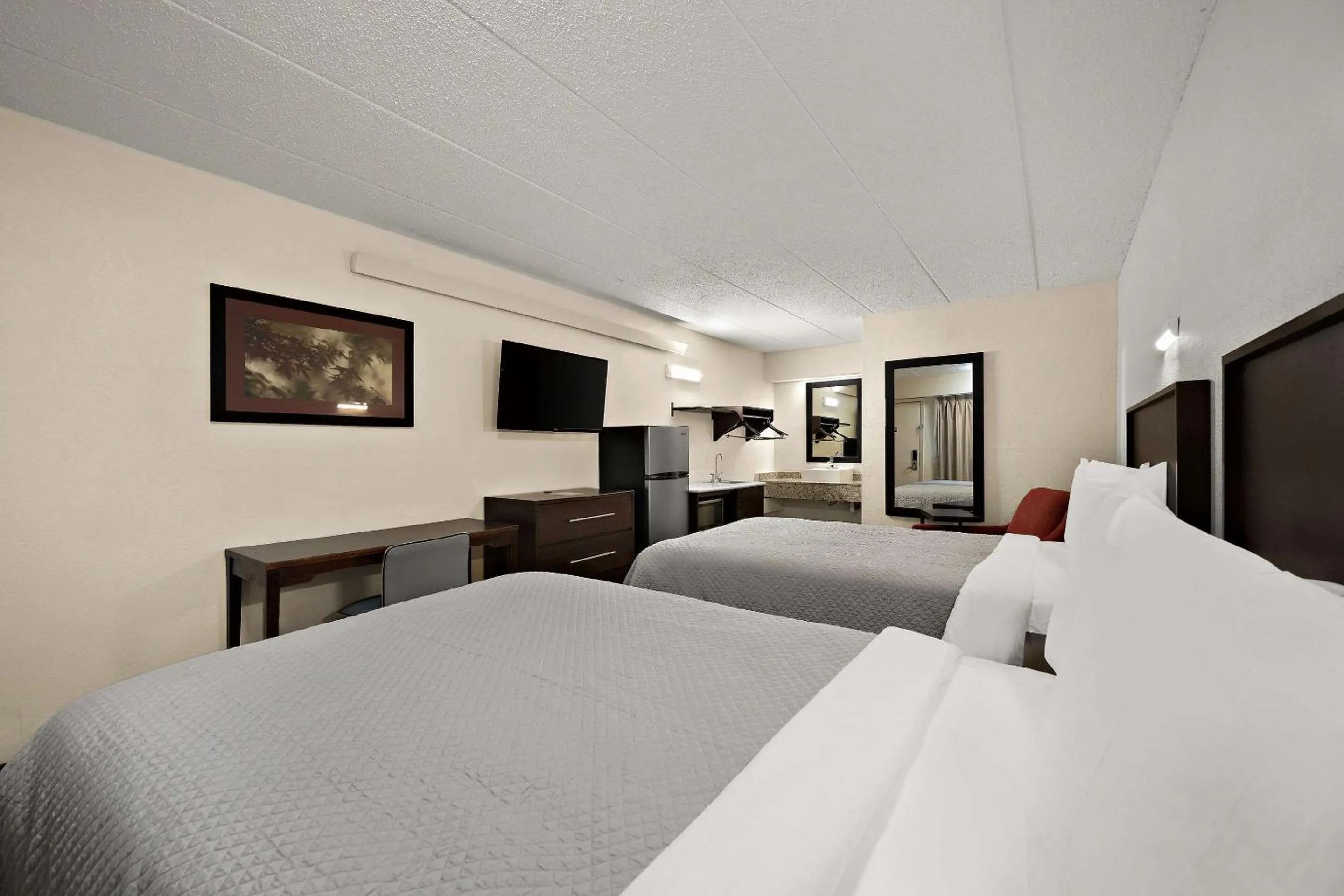 Bedroom, Bed in Suburban Studios Peoria