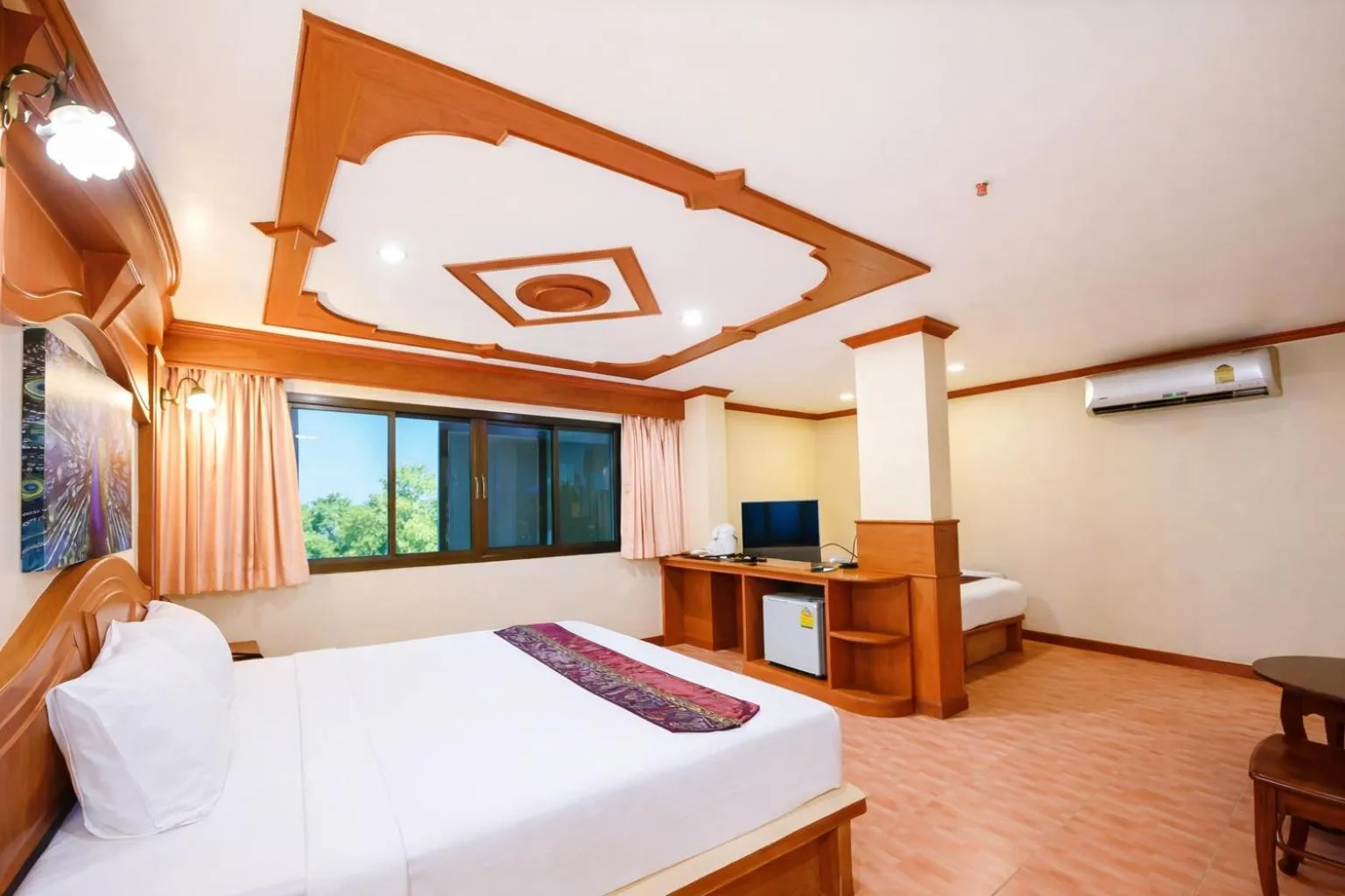 Bed in Tiger Complex Hotel