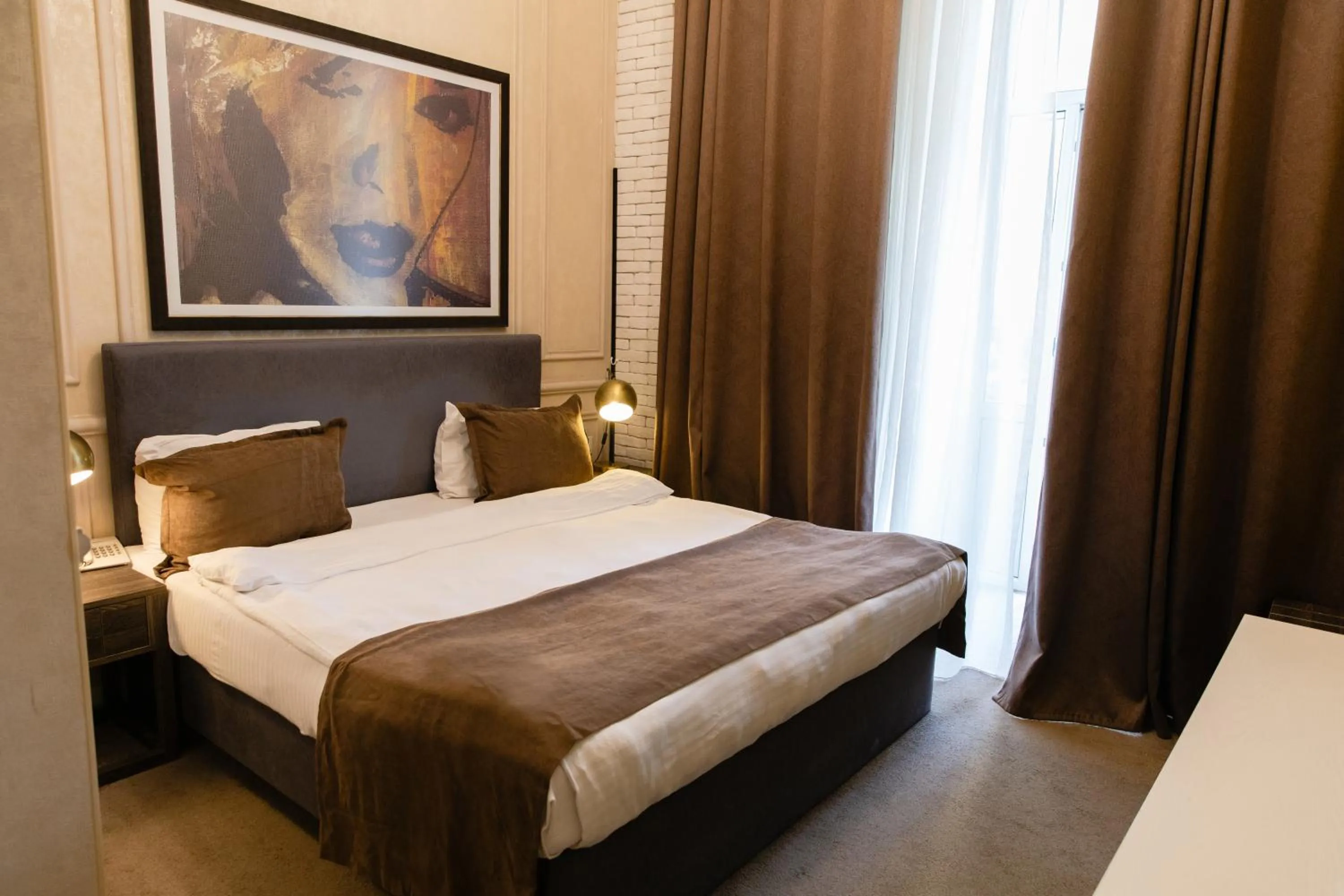 Bed in Zimmer Boutique Hotel