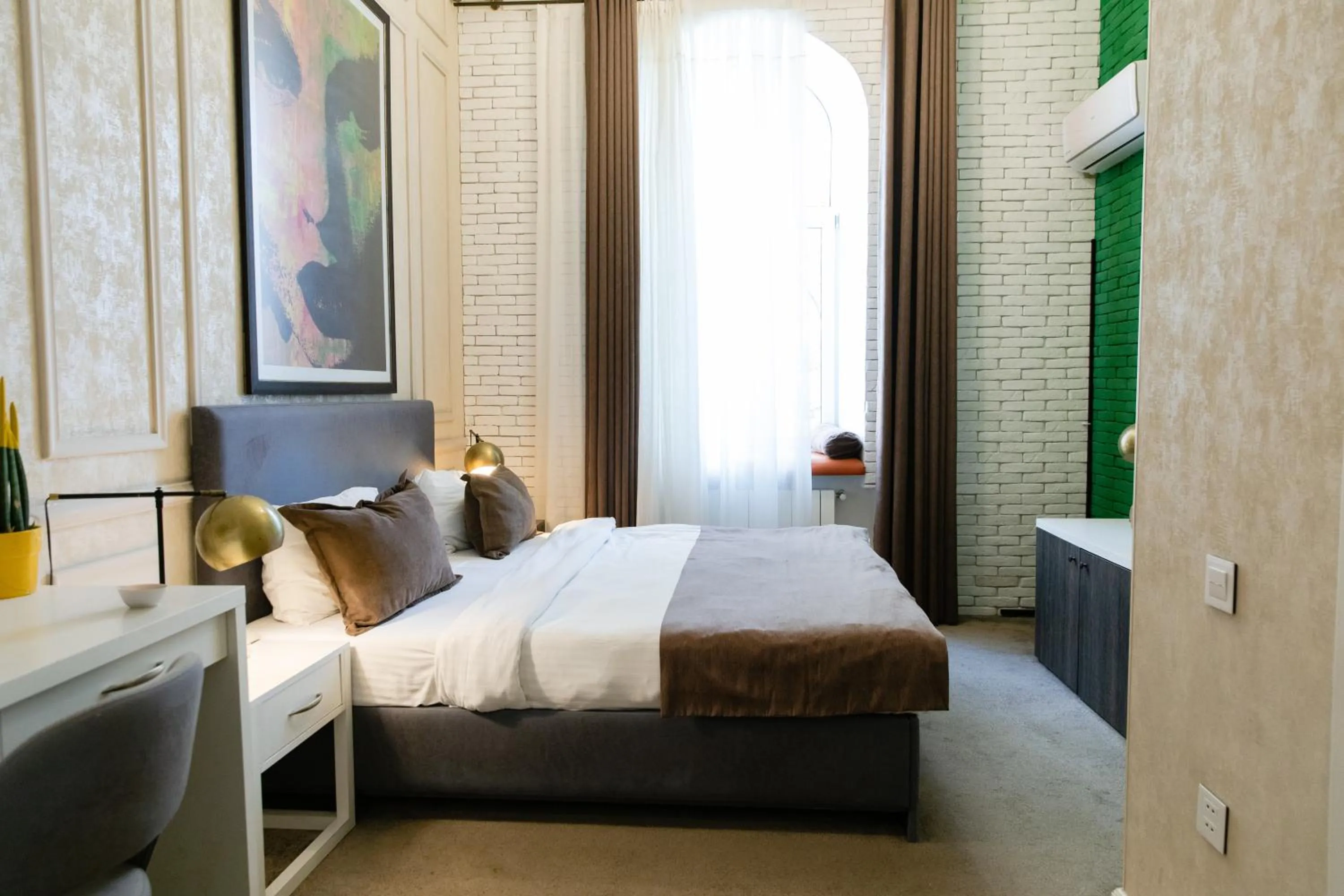 Bed in Zimmer Boutique Hotel