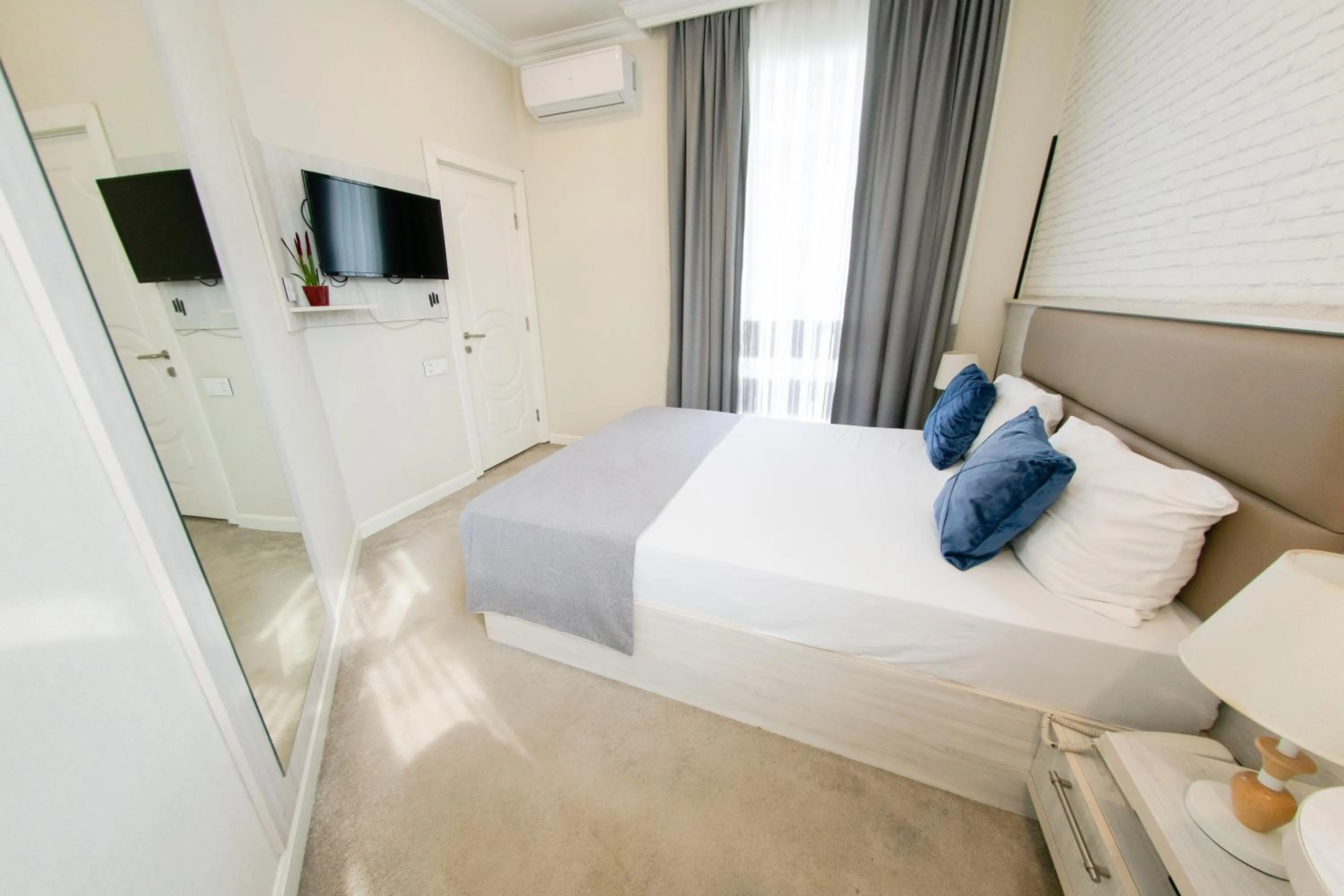 Bed in Zimmer Boutique Hotel