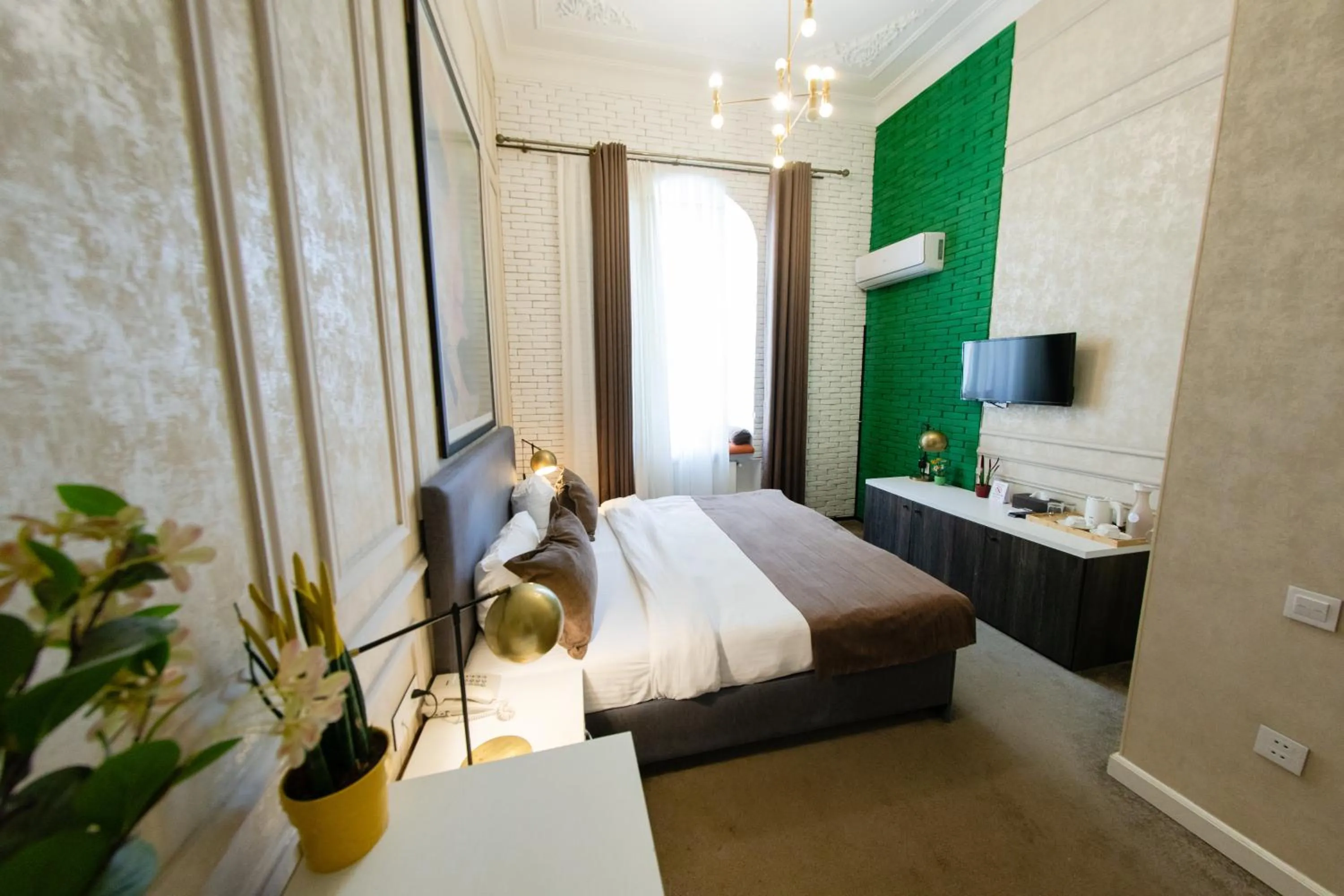 Bed in Zimmer Boutique Hotel