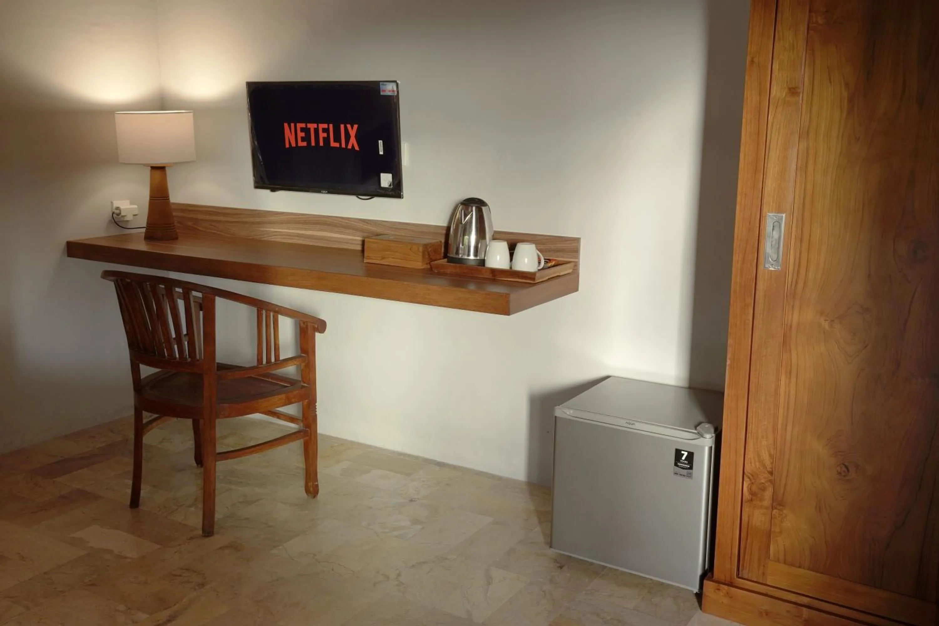 Communal lounge/ TV room in New Mumbul Ubud