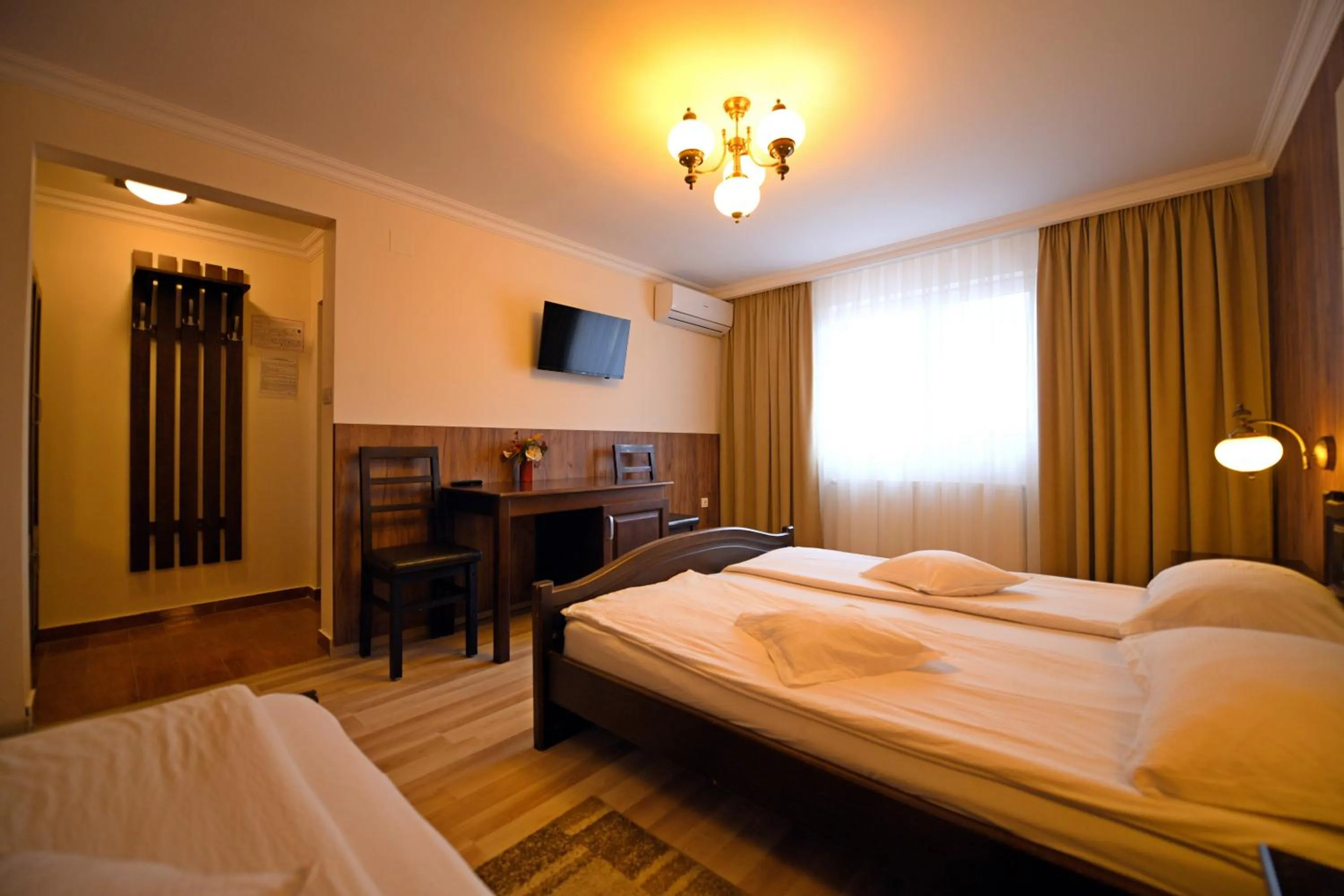 Photo of the whole room, Bed in Pensiunea Sarmis Cristal