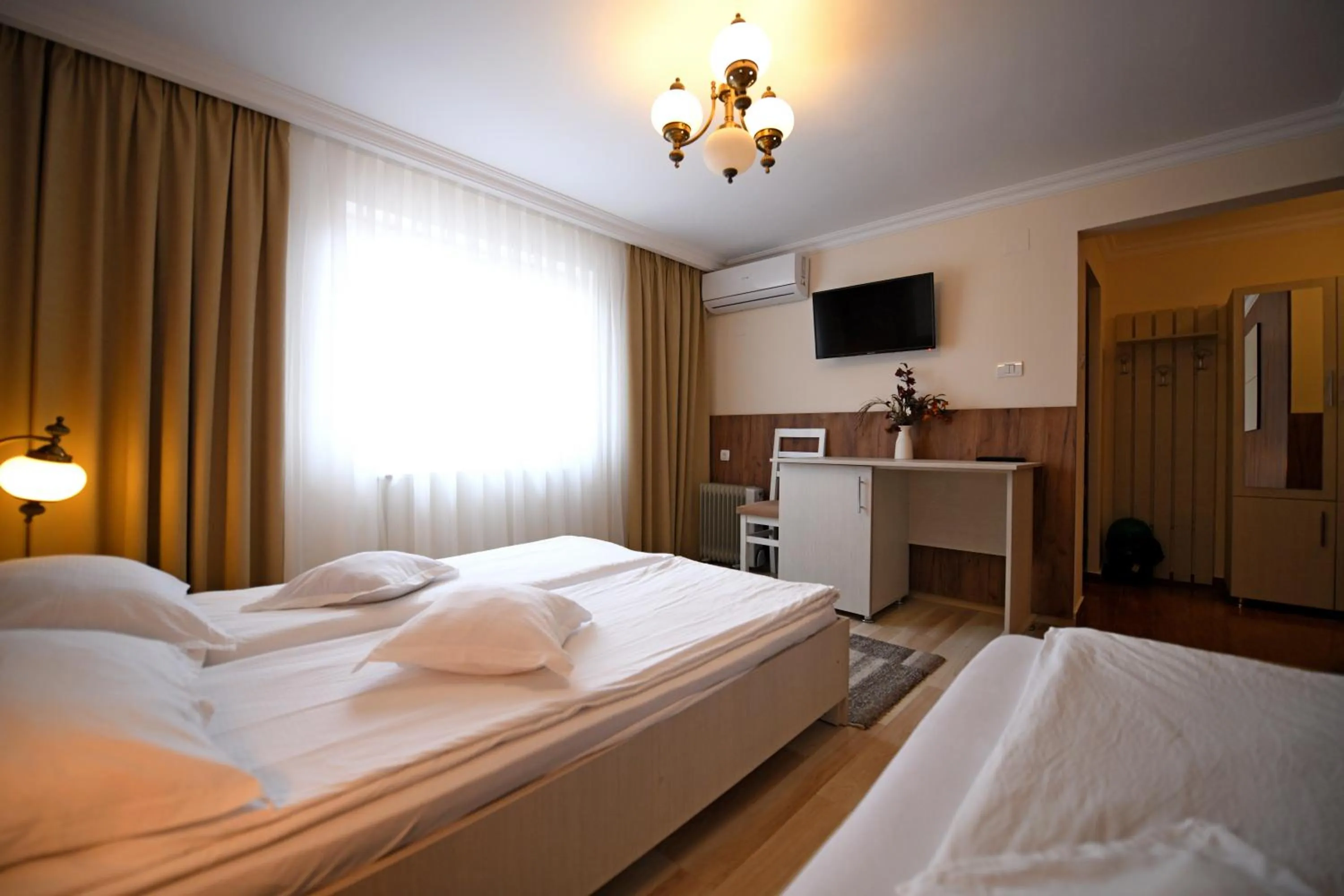 Photo of the whole room, Bed in Pensiunea Sarmis Cristal