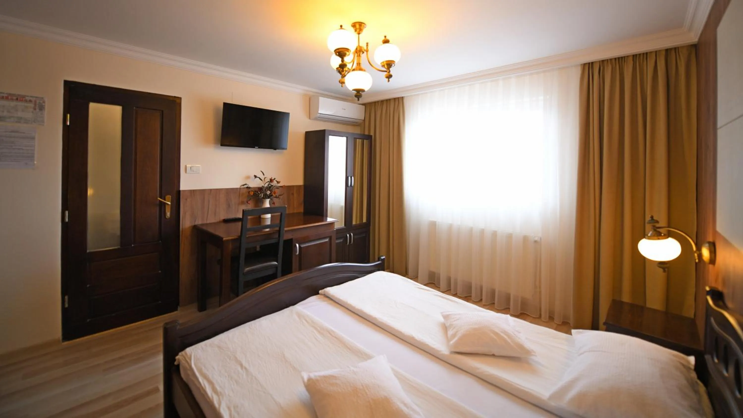 Photo of the whole room, Bed in Pensiunea Sarmis Cristal