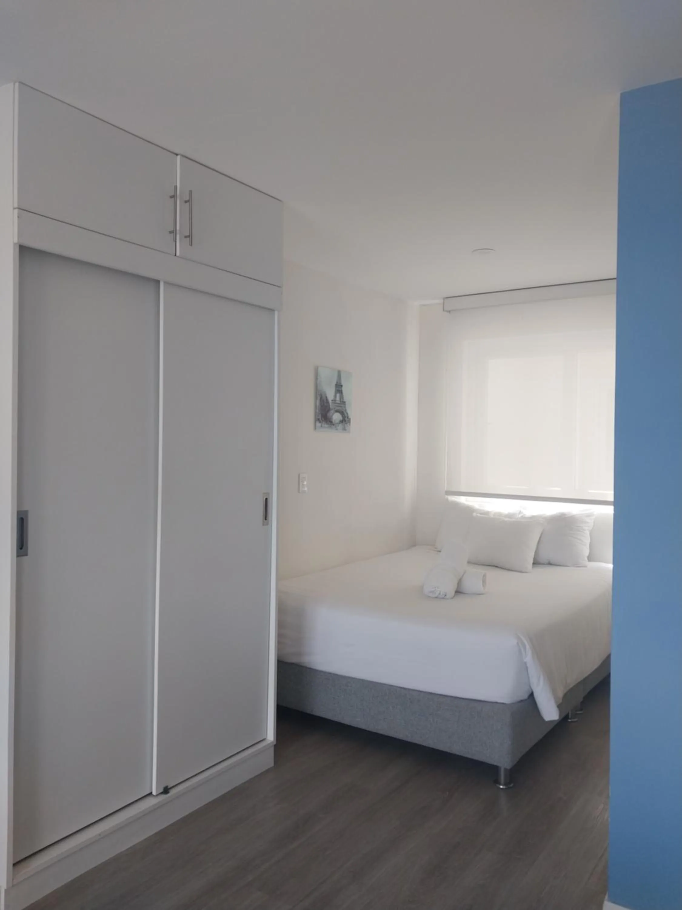 Bed in Quark Apartments