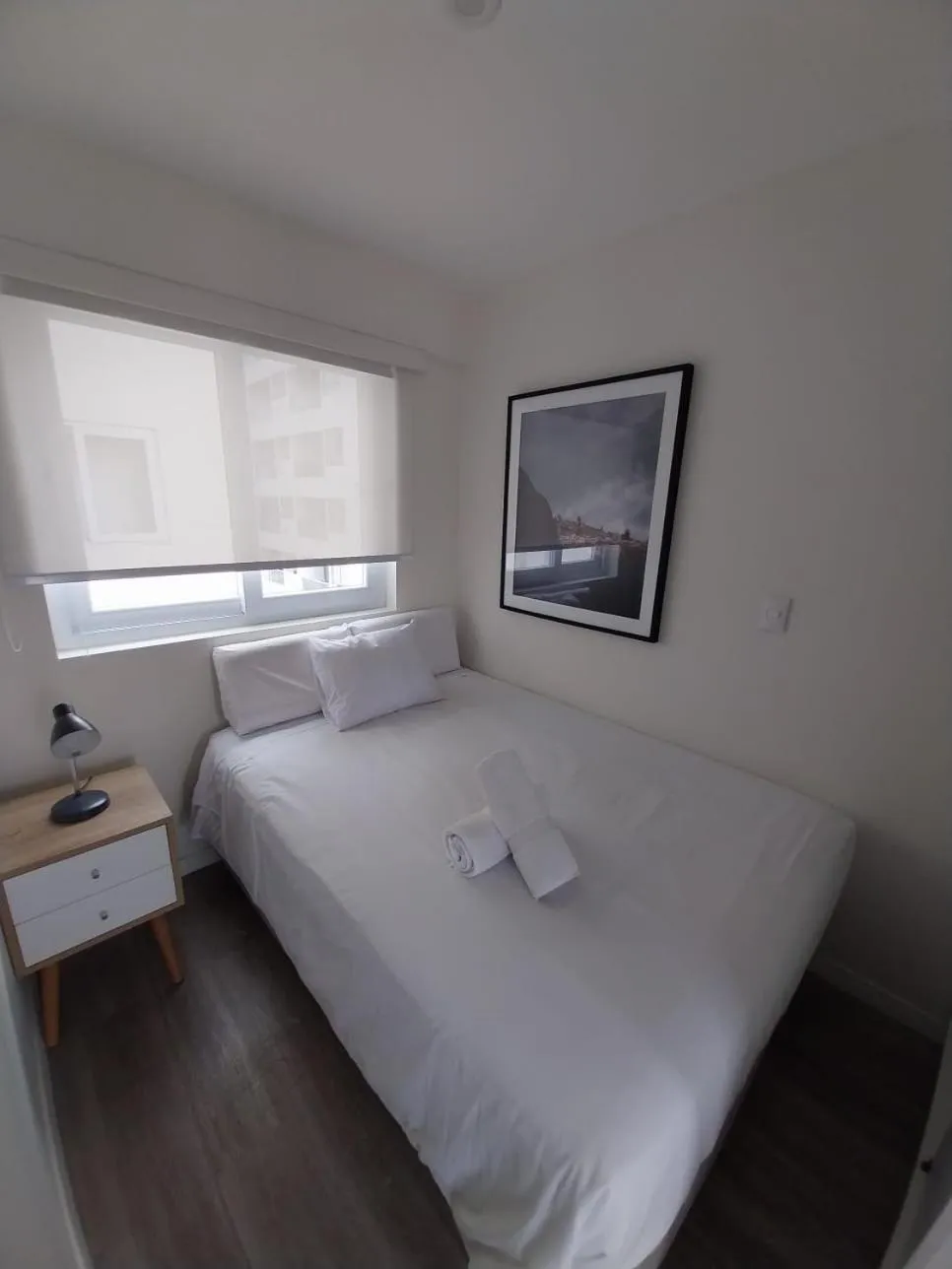 Bed in Quark Apartments