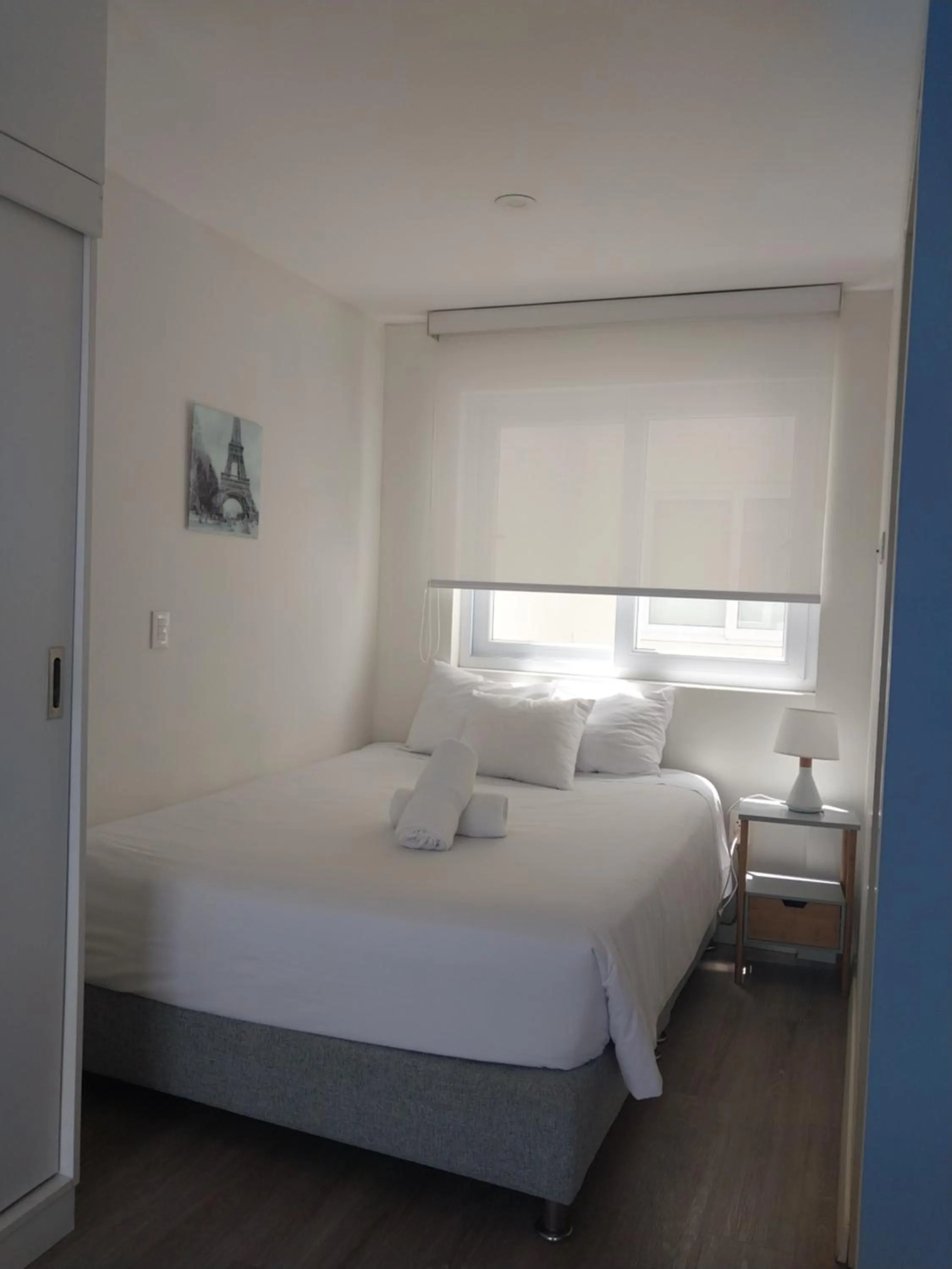 Bed in Quark Apartments