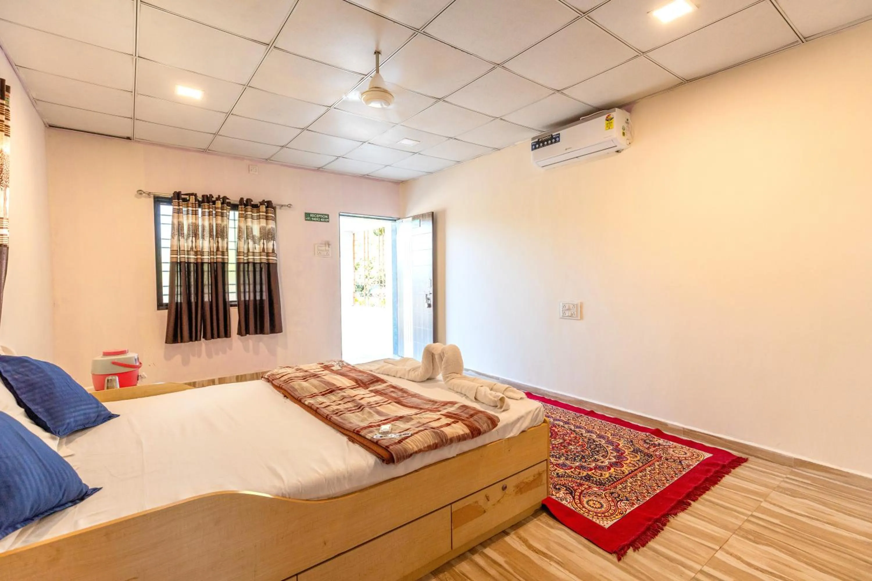 Photo of the whole room, Bed in AamraKunj Gir Resort