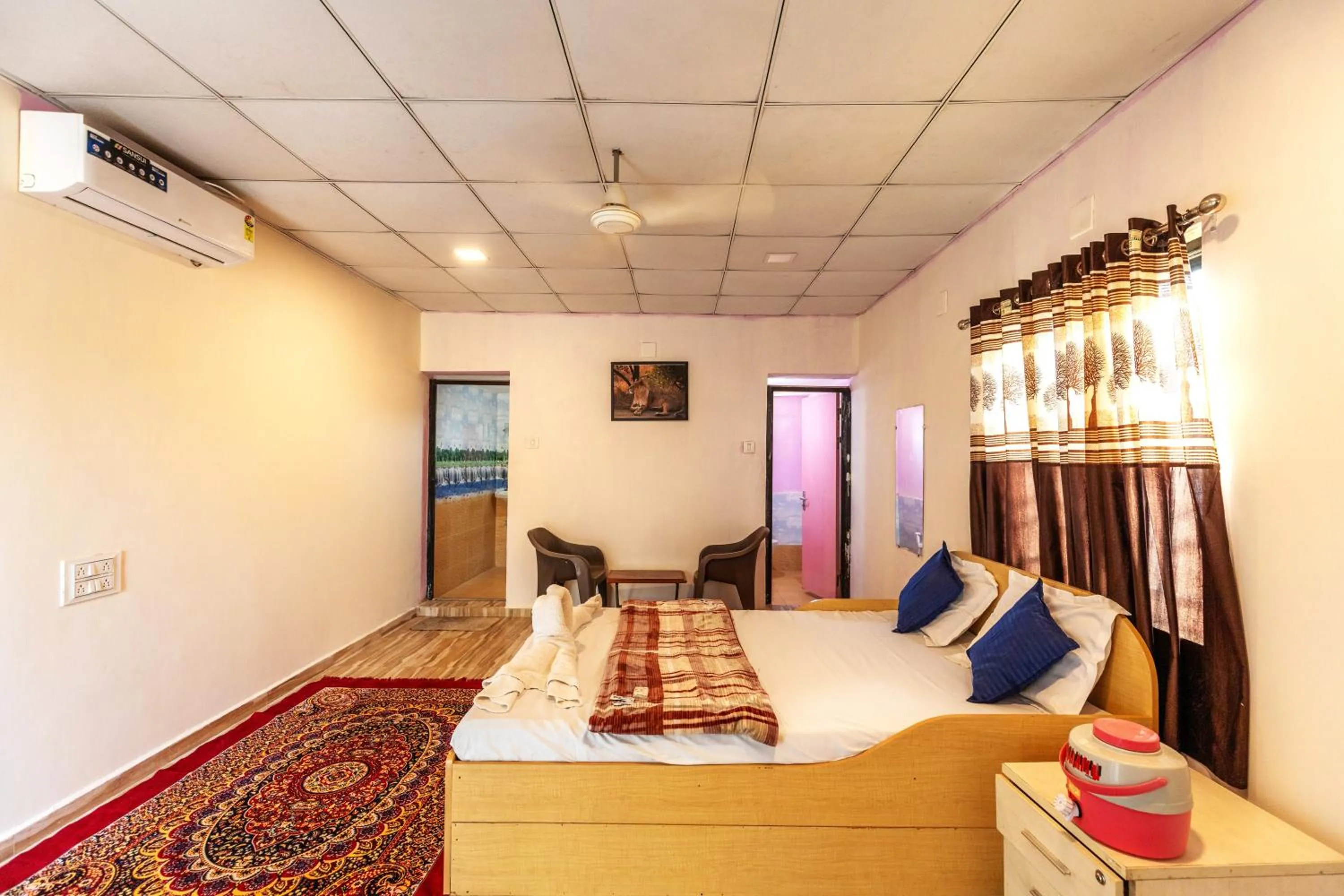 Photo of the whole room, Bed in AamraKunj Gir Resort