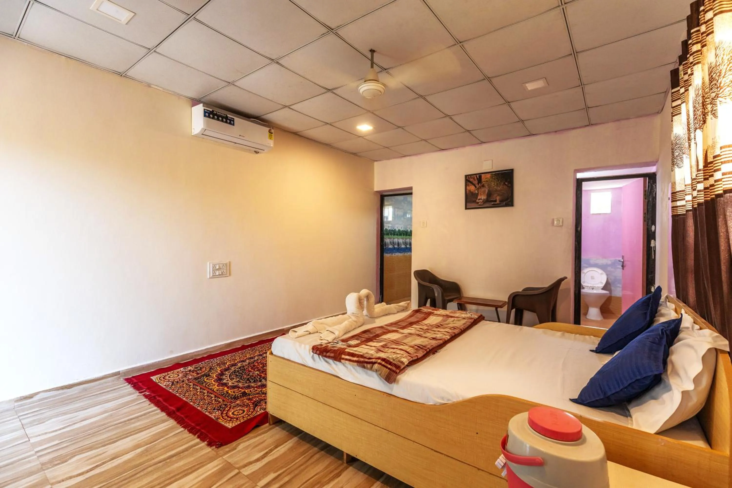 Photo of the whole room, Bed in AamraKunj Gir Resort