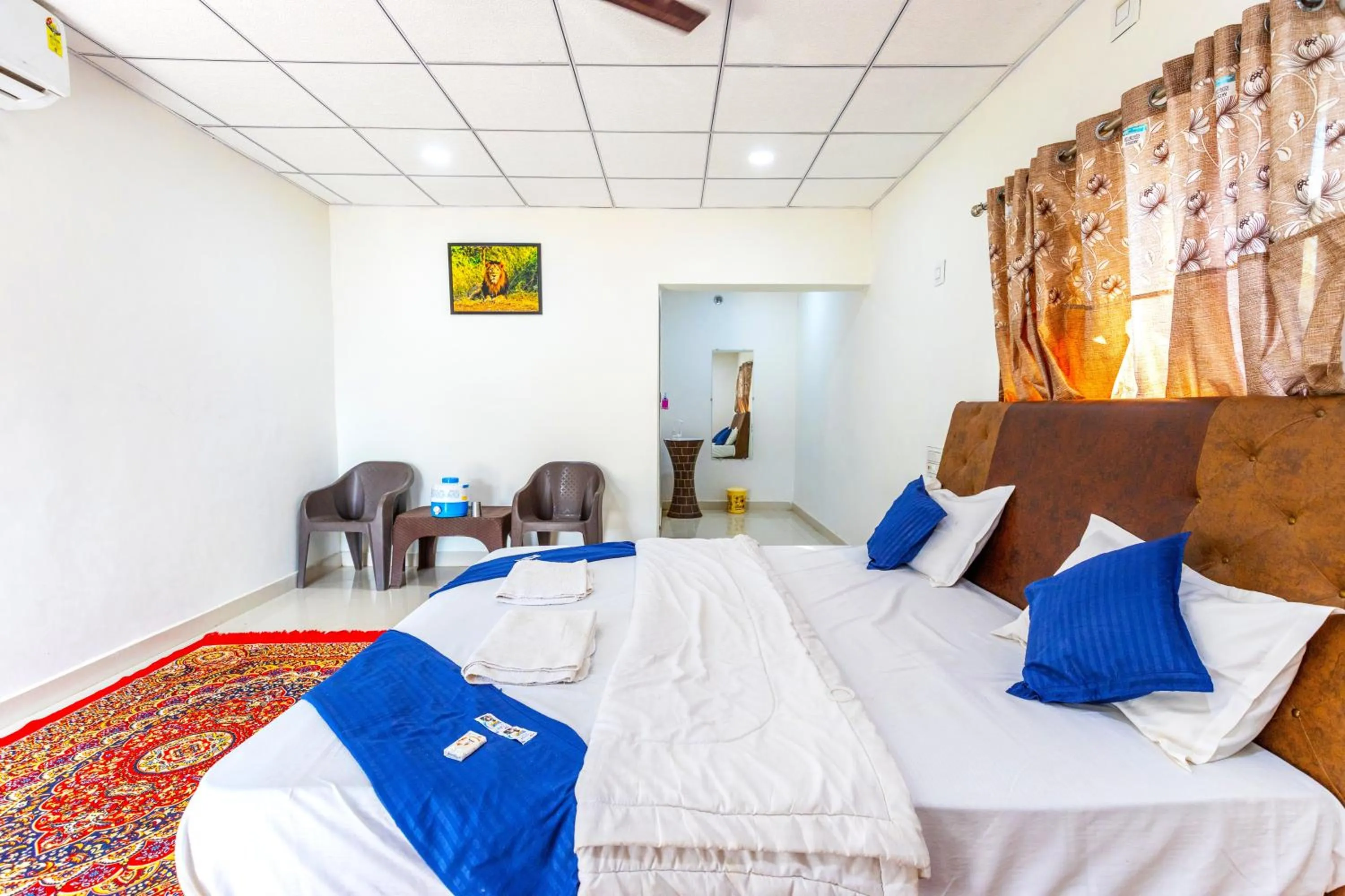 Bed in AamraKunj Gir Resort