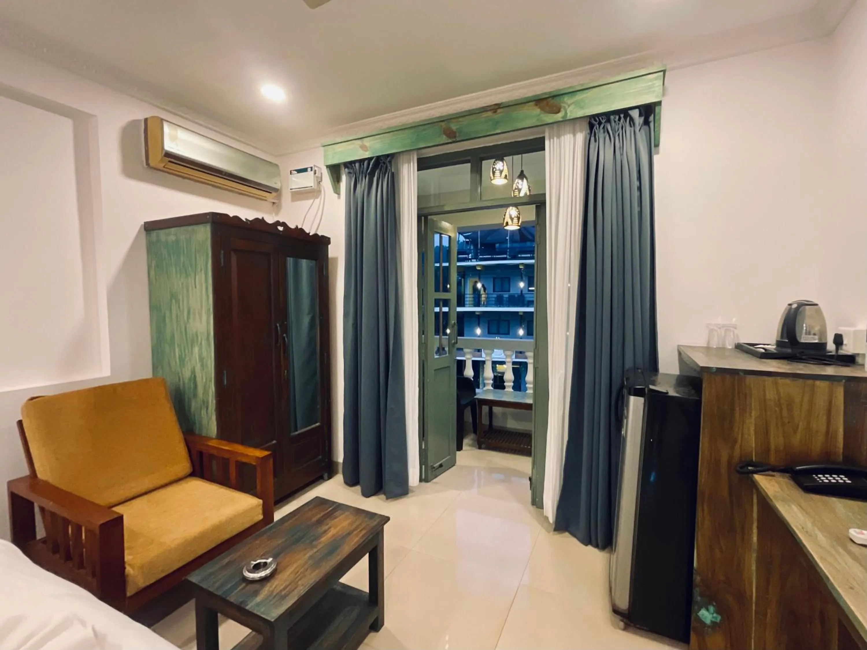 Living room, Bed in Nagas Hotel Satyavati Morjim