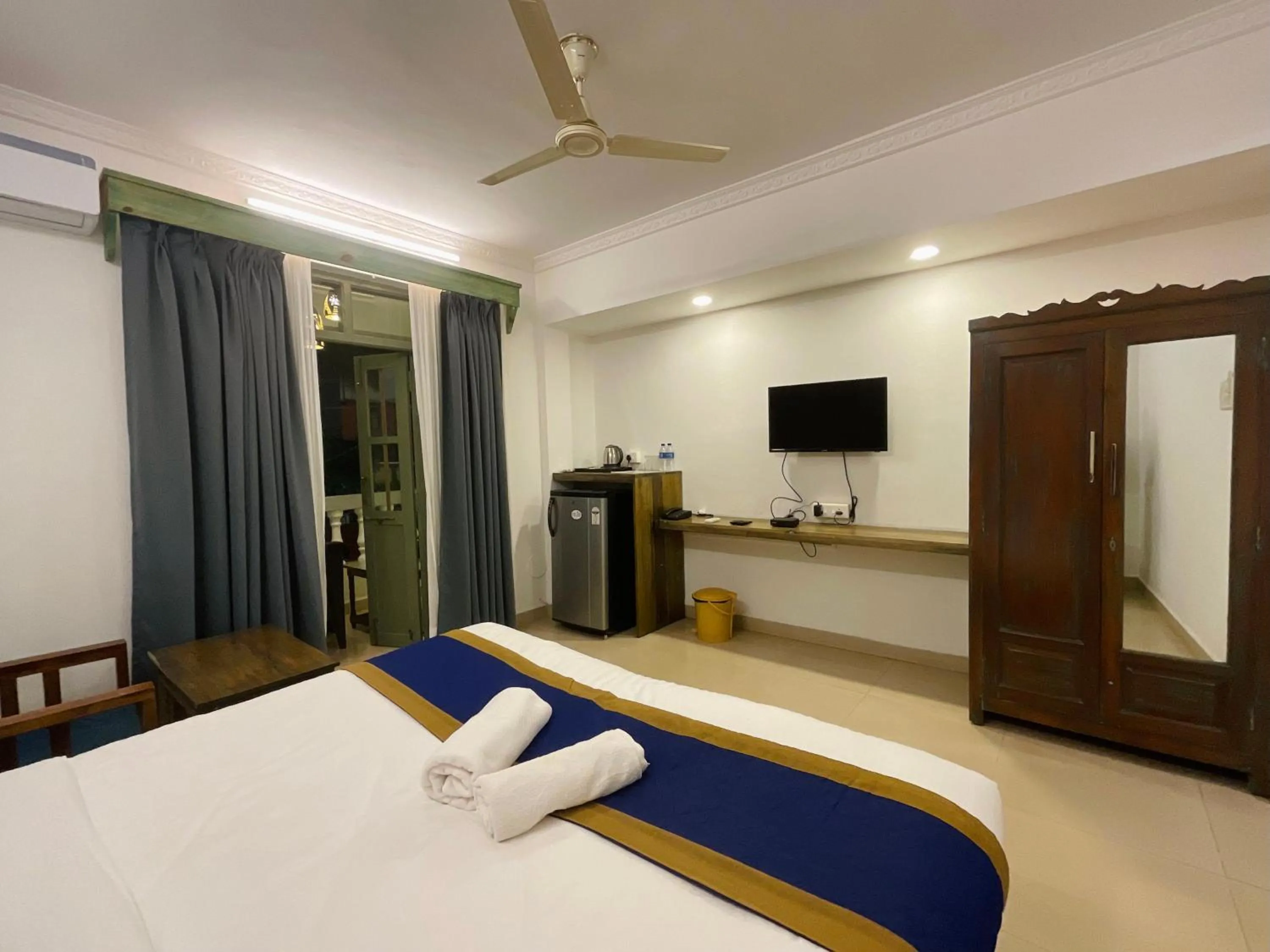Bed in Nagas Hotel Satyavati Morjim