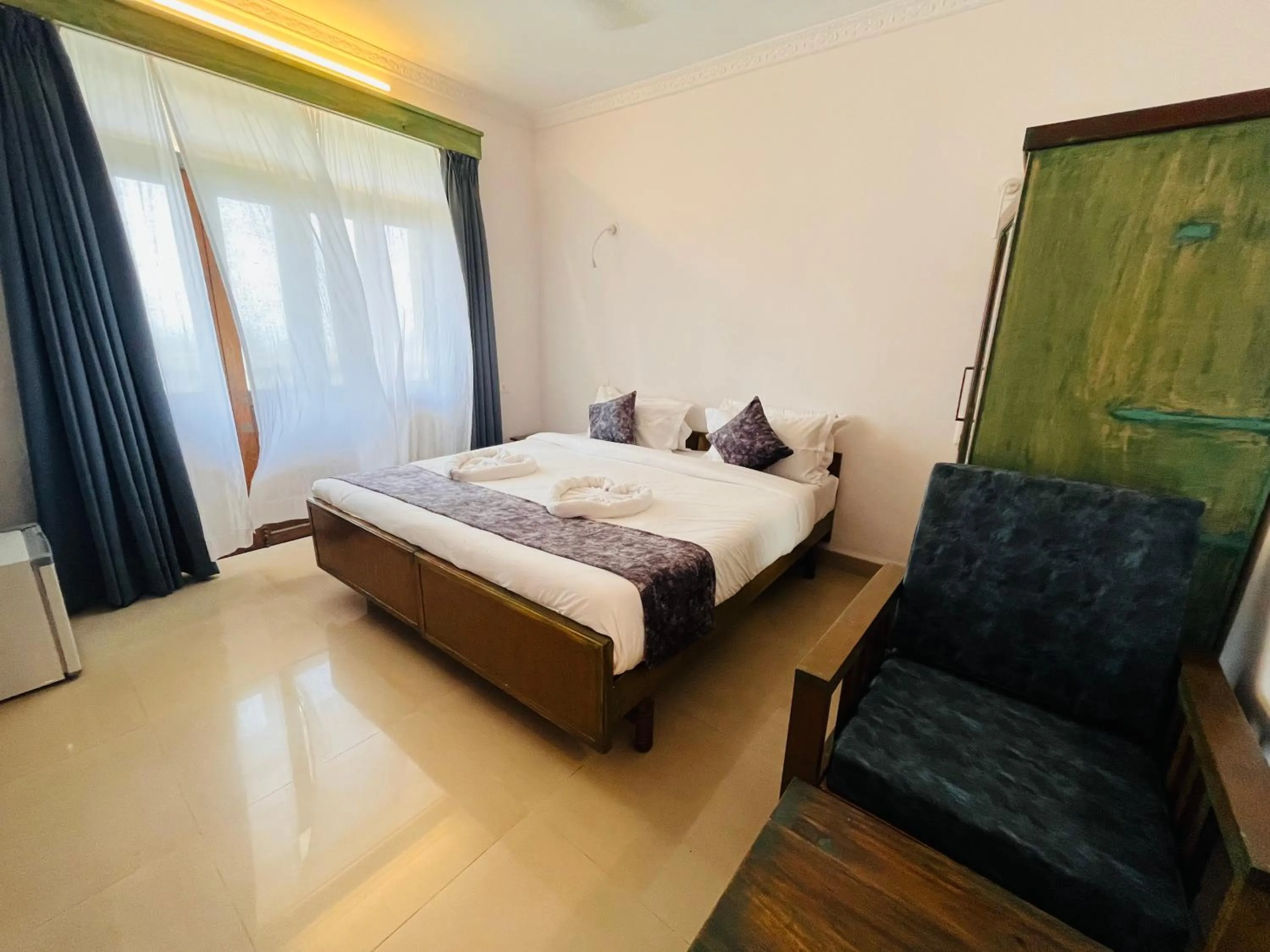 Bed in Nagas Hotel Satyavati Morjim