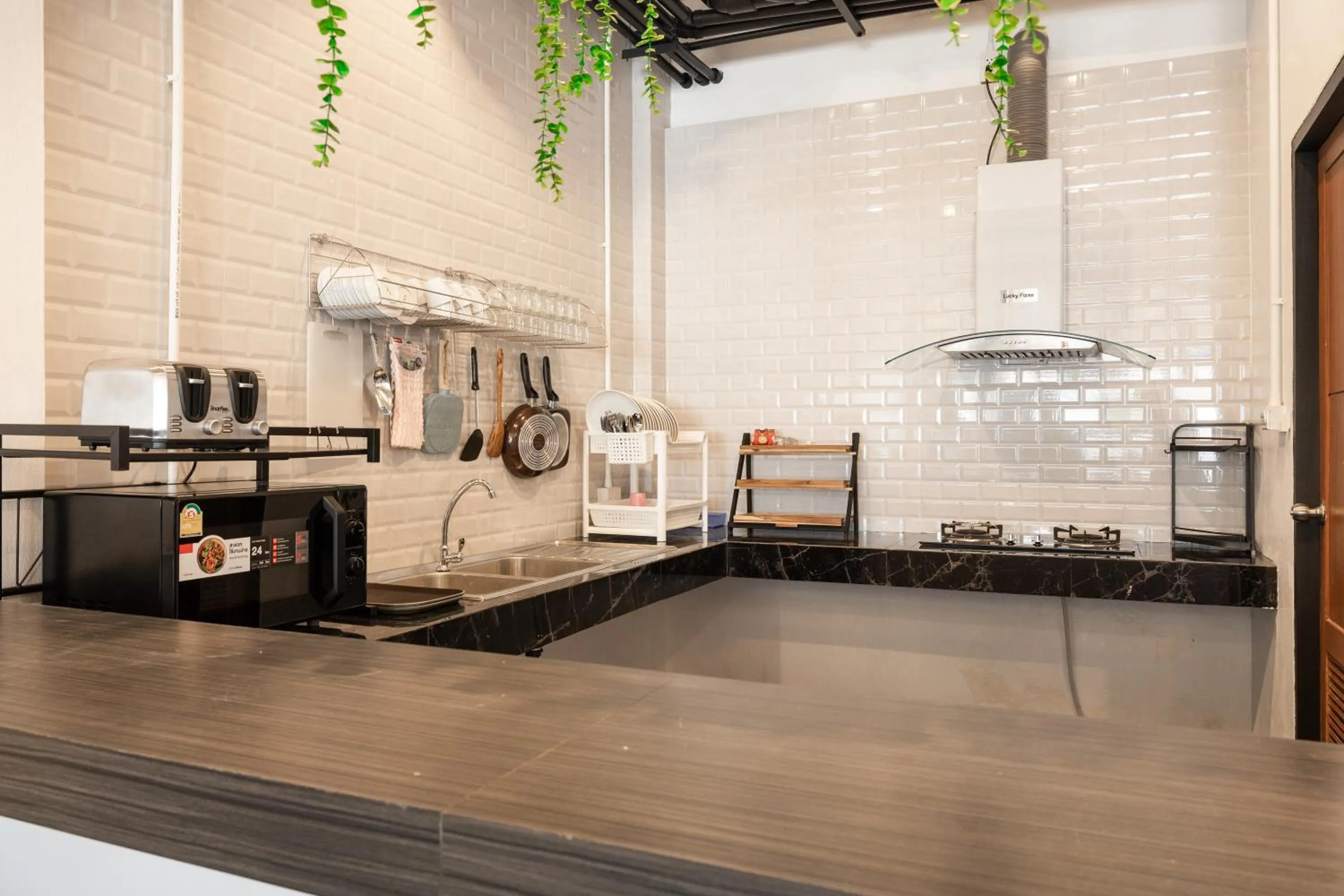 Kitchen or kitchenette in Marco Polo Phuket Poshtel & Bistro