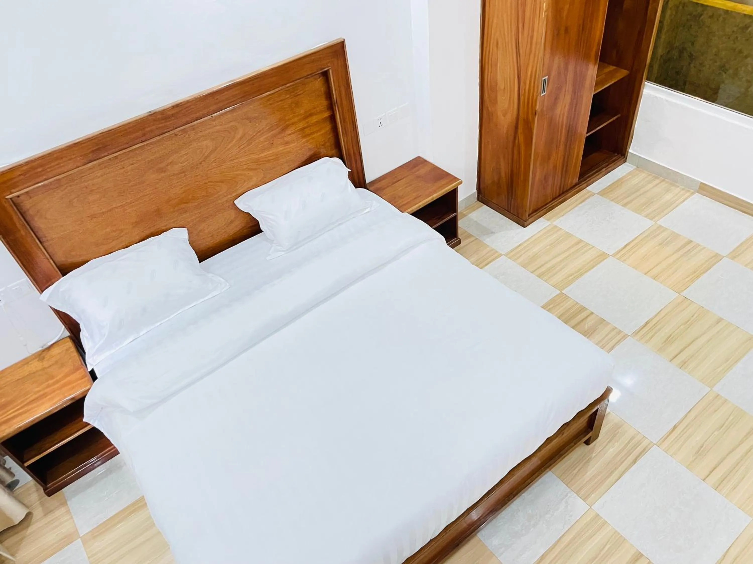 Bed in Pulickal Heights Hotel
