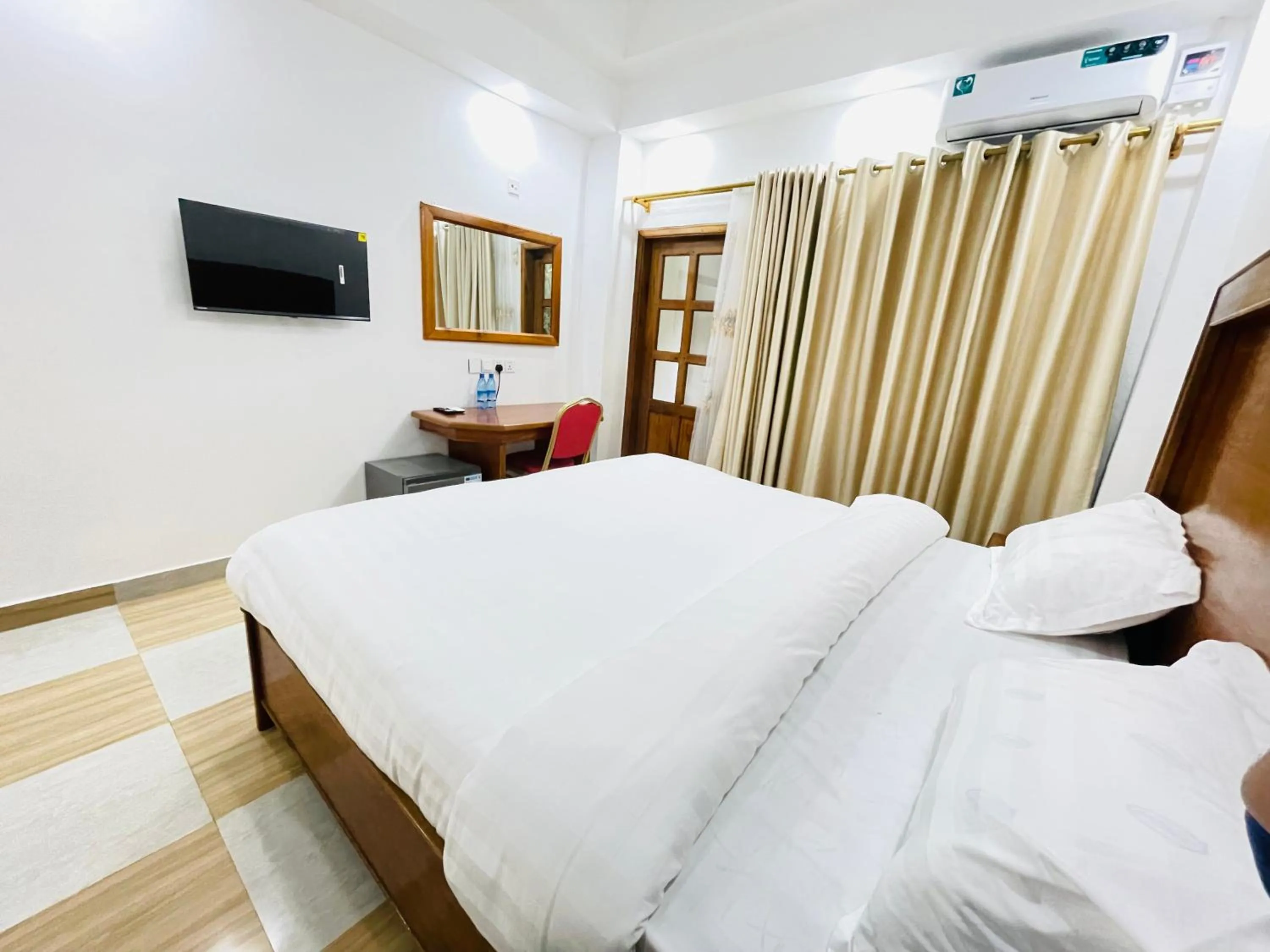 Bed in Pulickal Heights Hotel