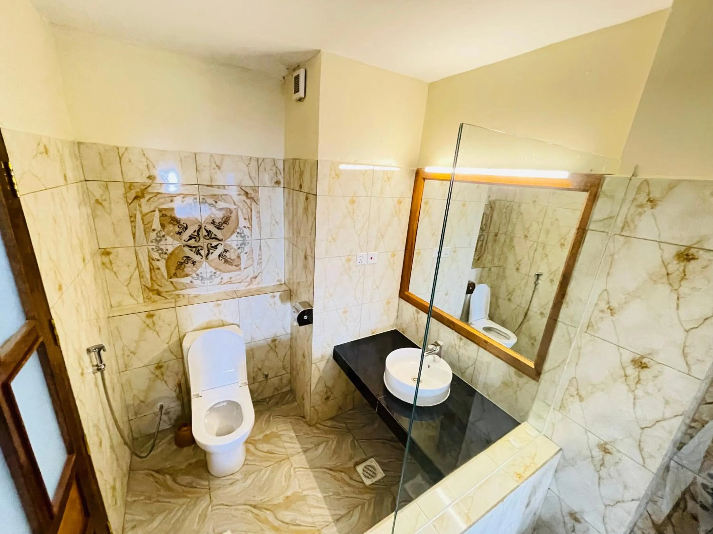 Toilet in Pulickal Heights Hotel