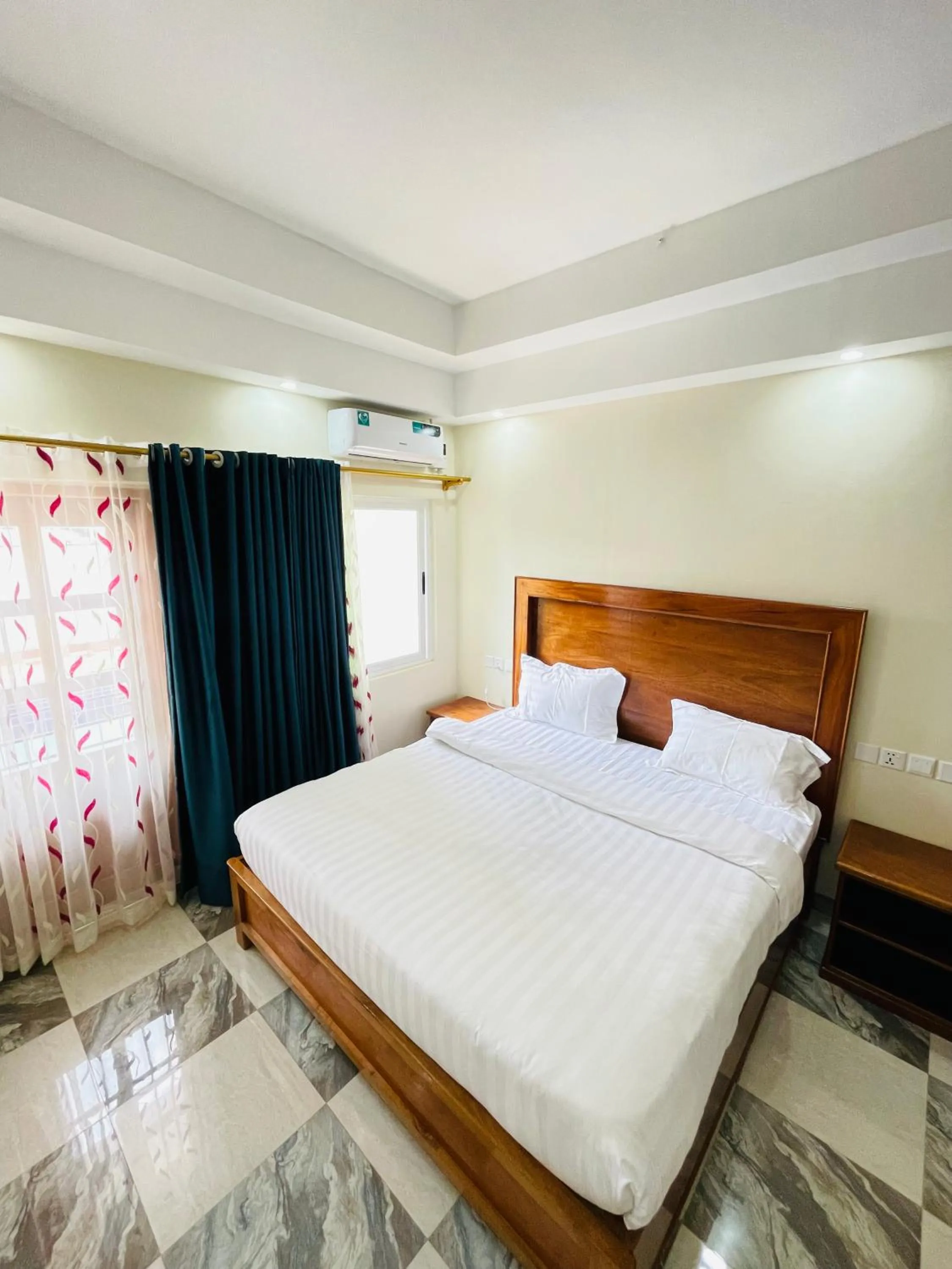 Bed in Pulickal Heights Hotel