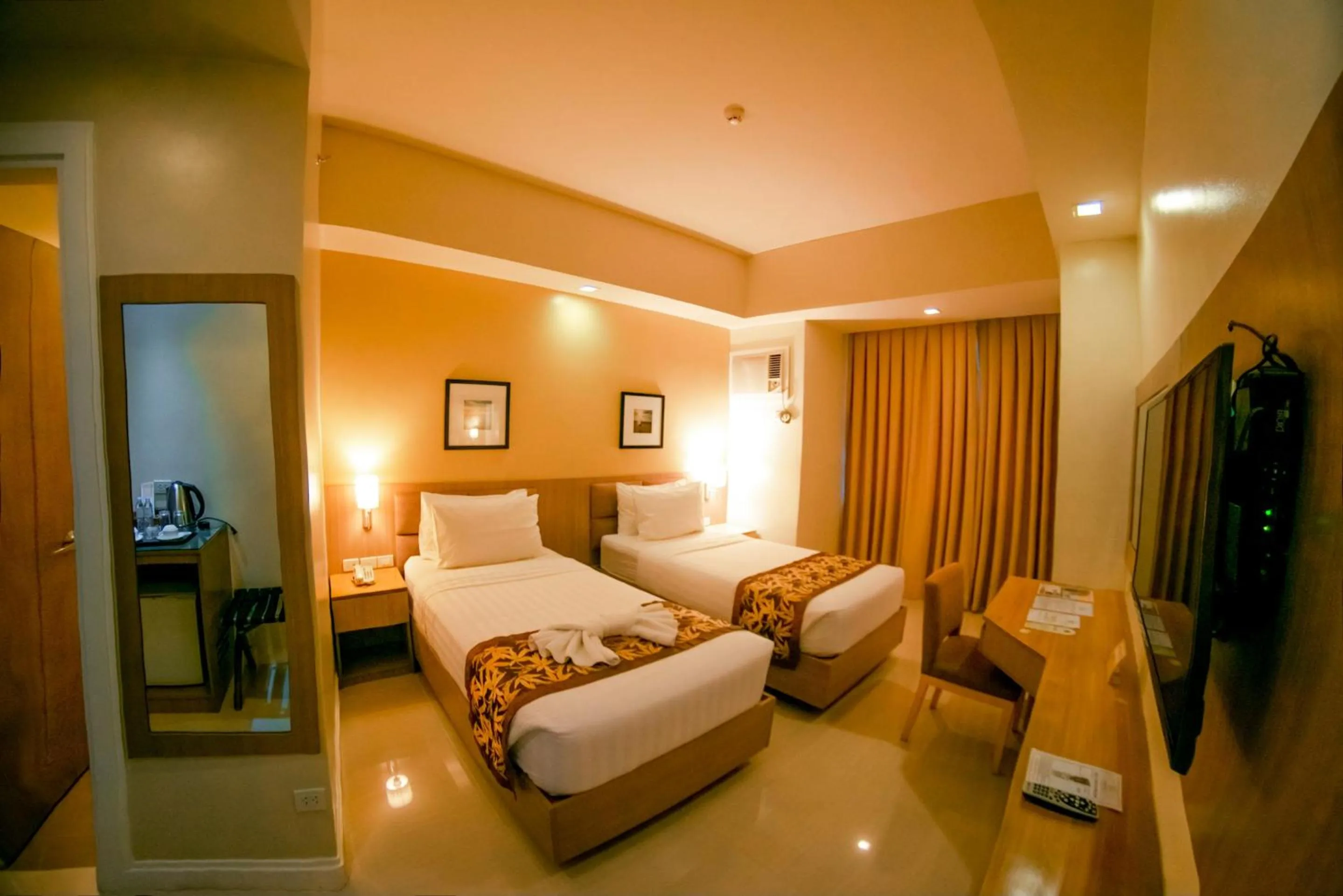 Bed in Zerenity Hotel & Suites