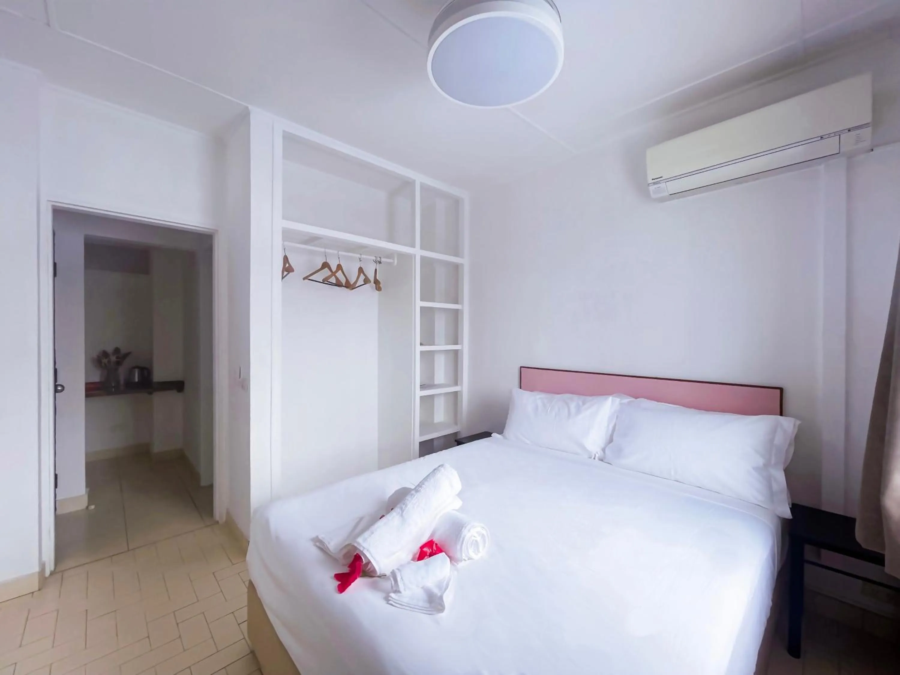 Bed in Coconut Palms Resort & Diamond Casino