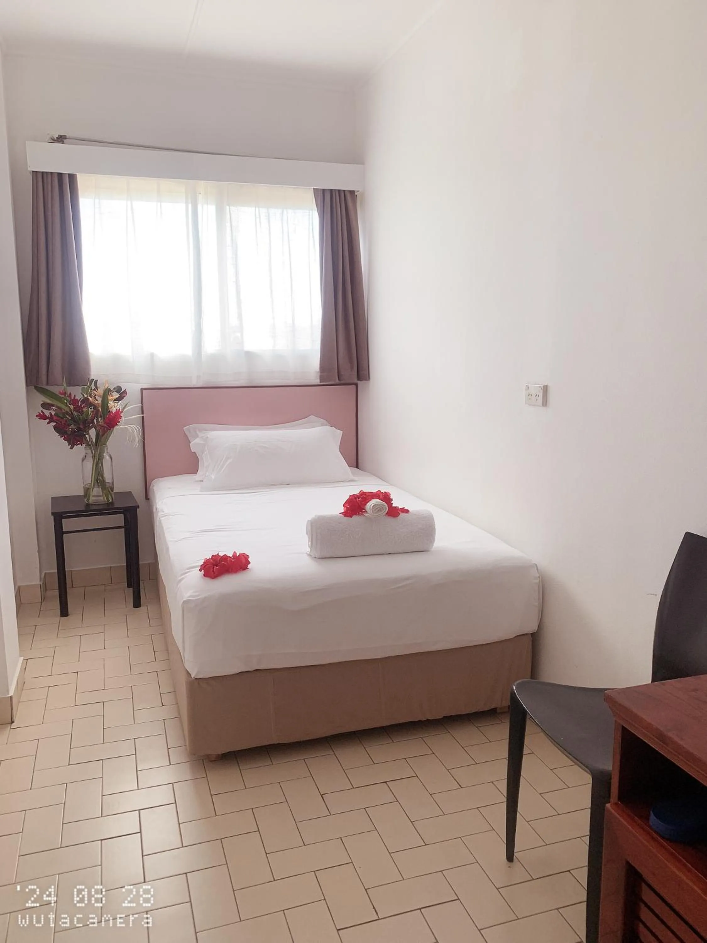 Bed in Coconut Palms Resort & Diamond Casino