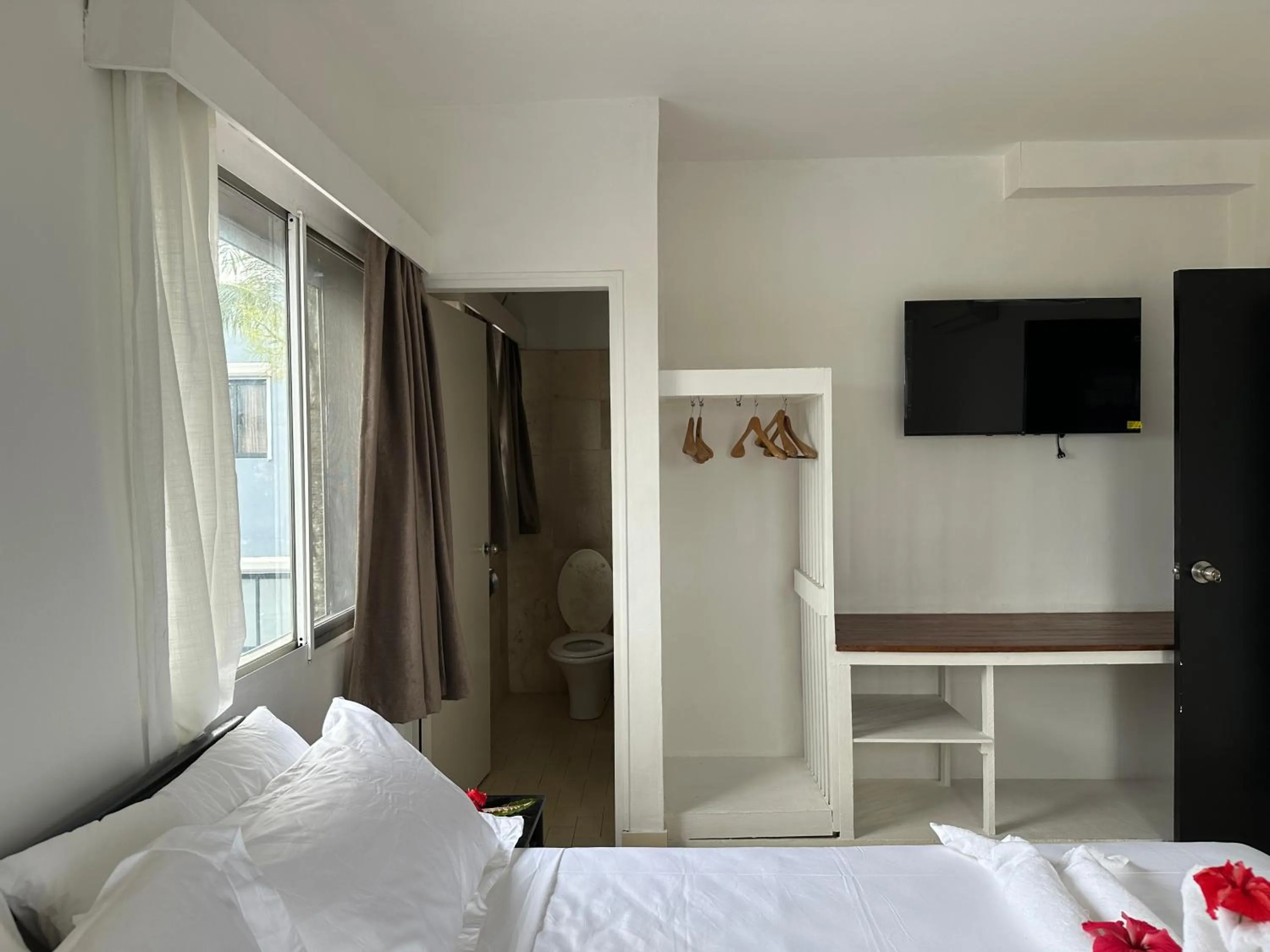 Bed in Coconut Palms Resort & Diamond Casino