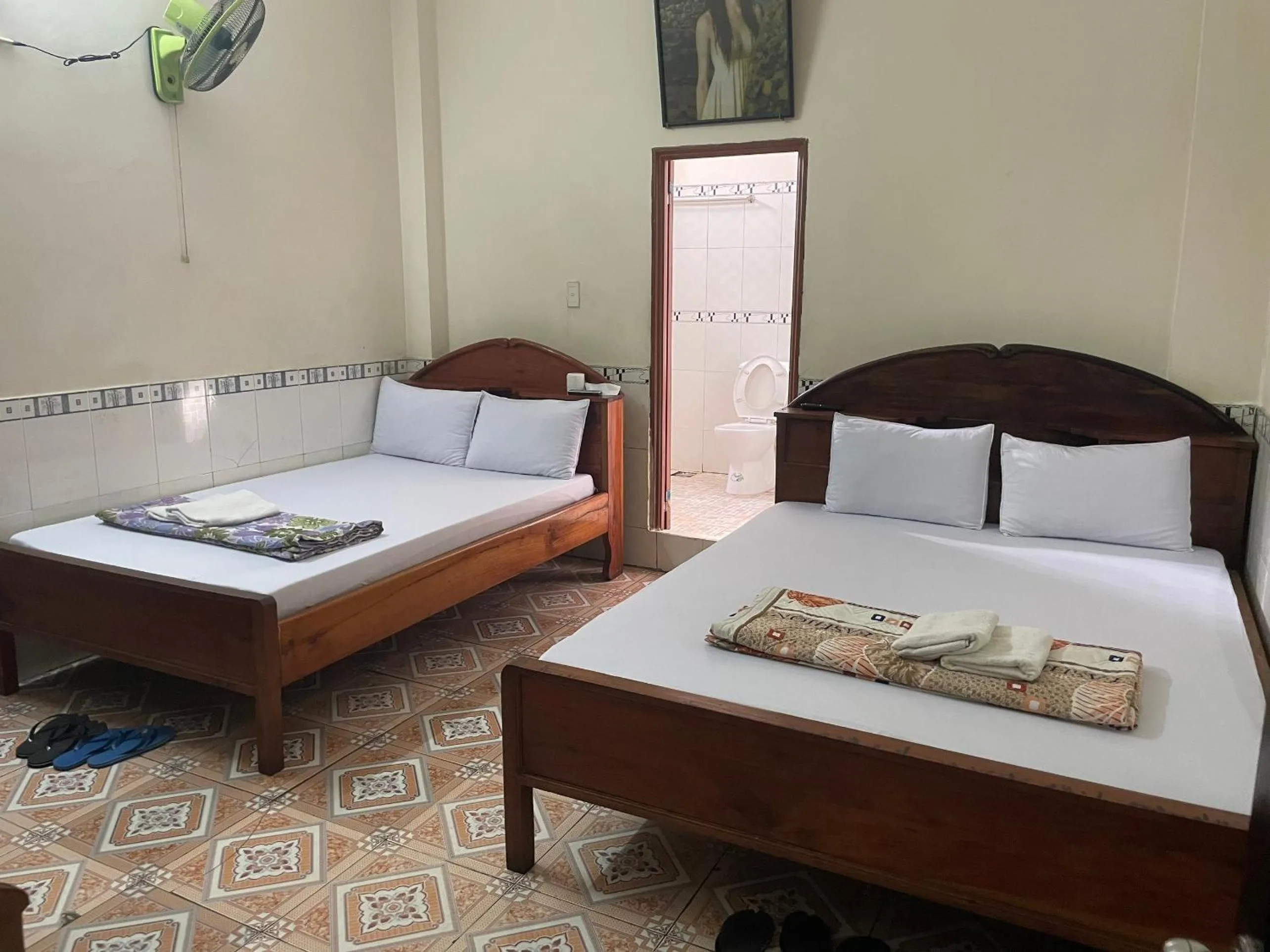 Bed in QUỲNH HOA HOTEL