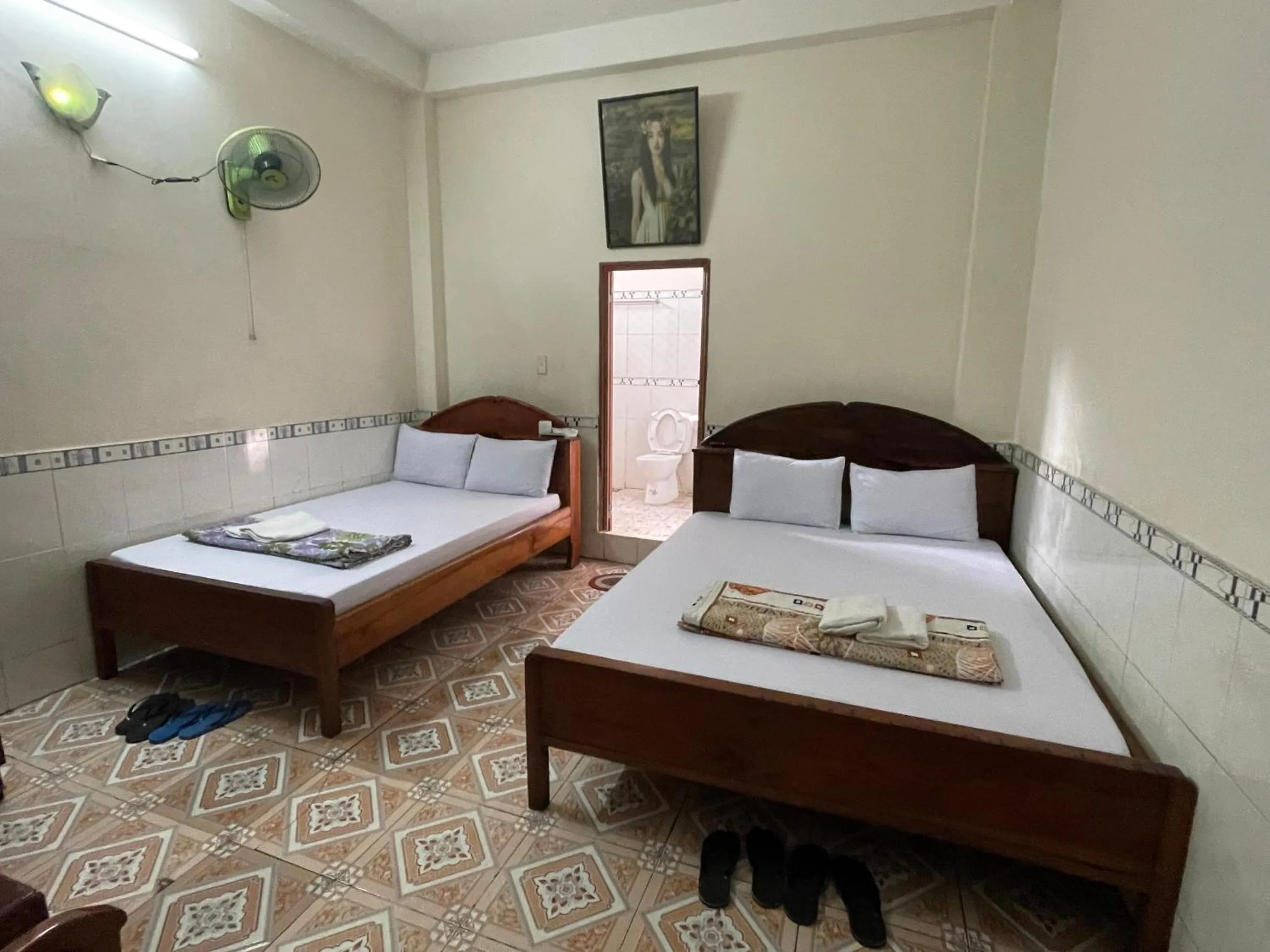 Bed in QUỲNH HOA HOTEL