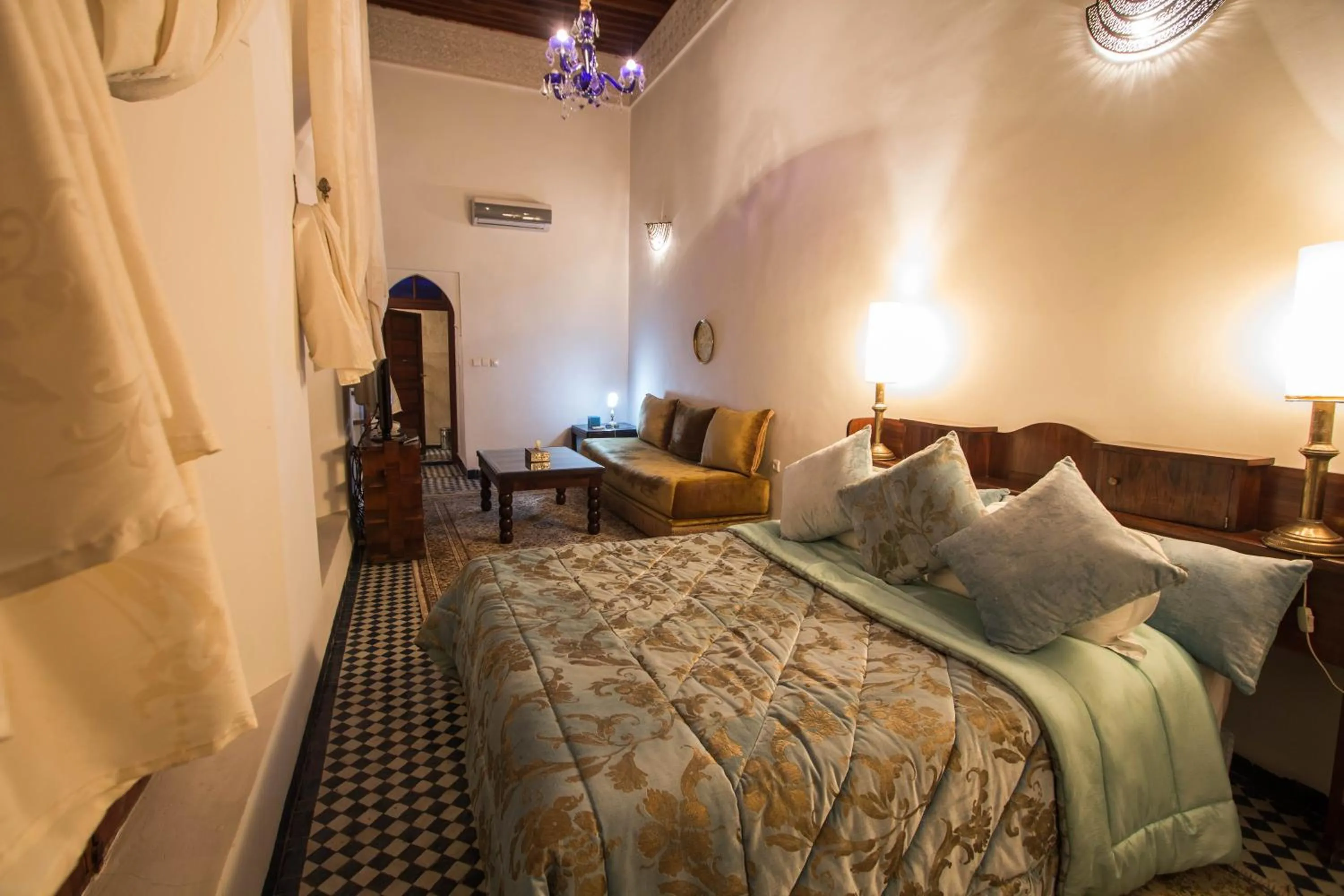 Photo of the whole room, Bed in Riad Noujoum Medina