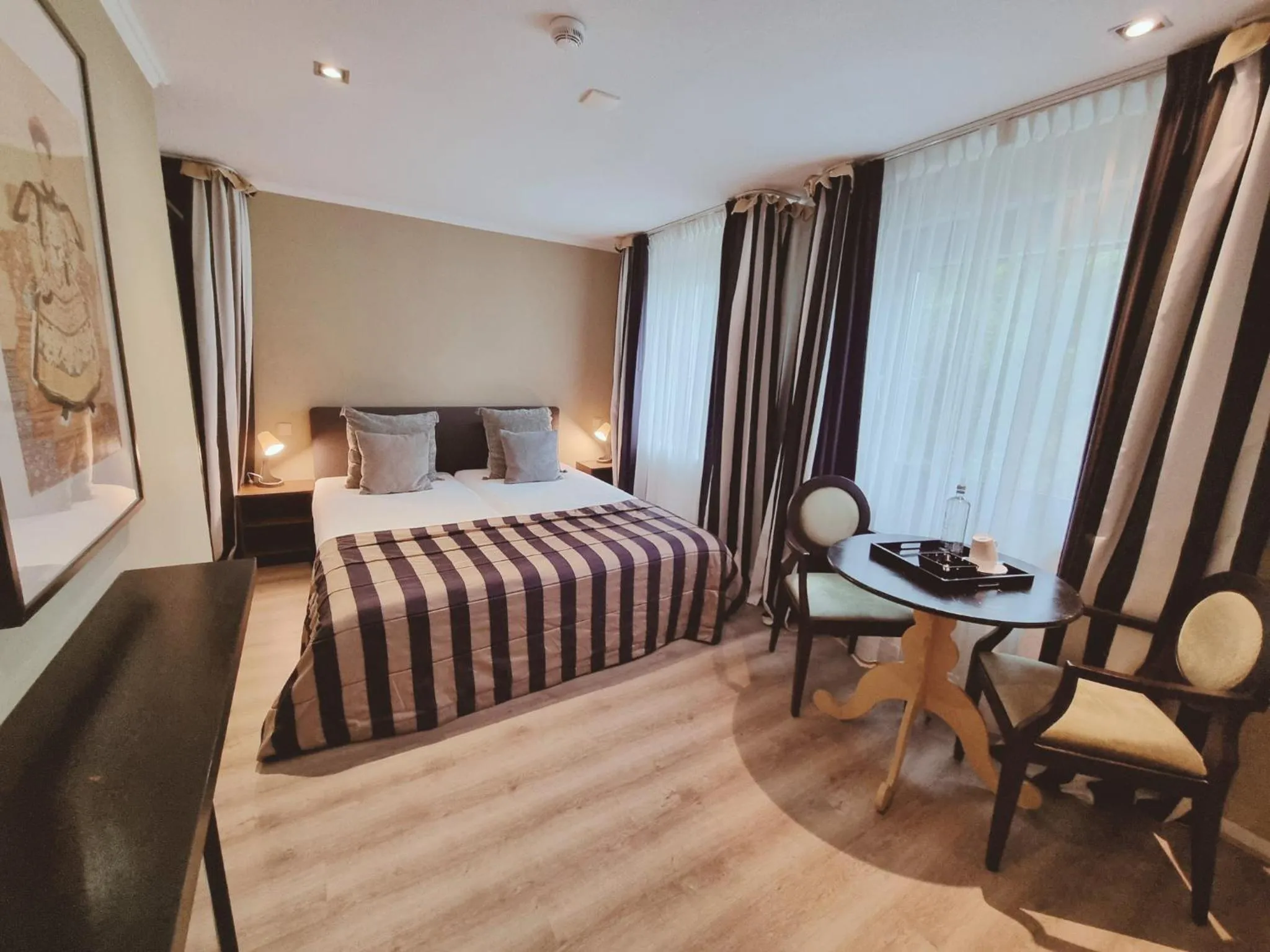 Photo of the whole room, Bed in Saillant Hotel Gulpenerland - Auping Hotel Partner