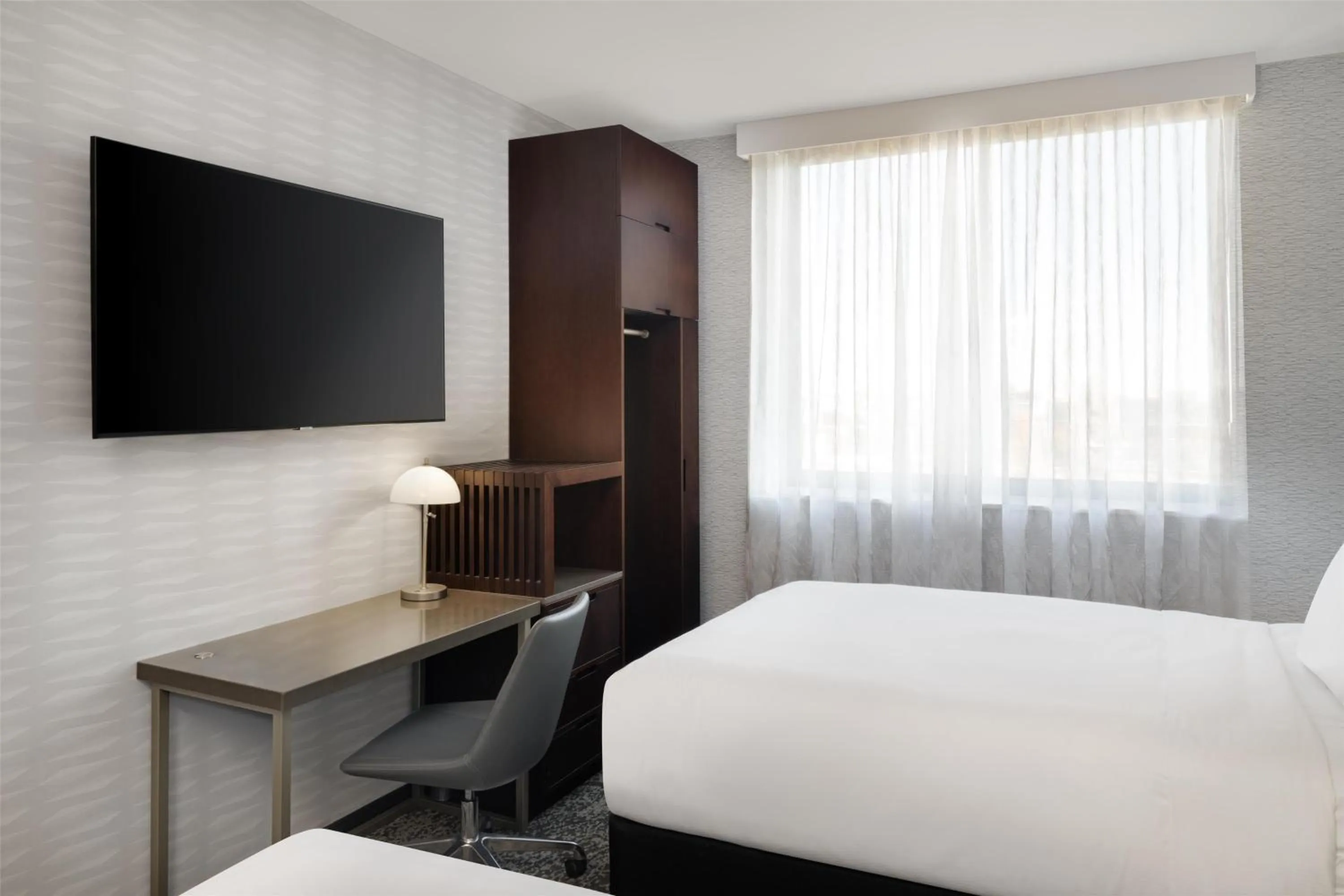 Bed in DoubleTree by Hilton Long Island City, NY