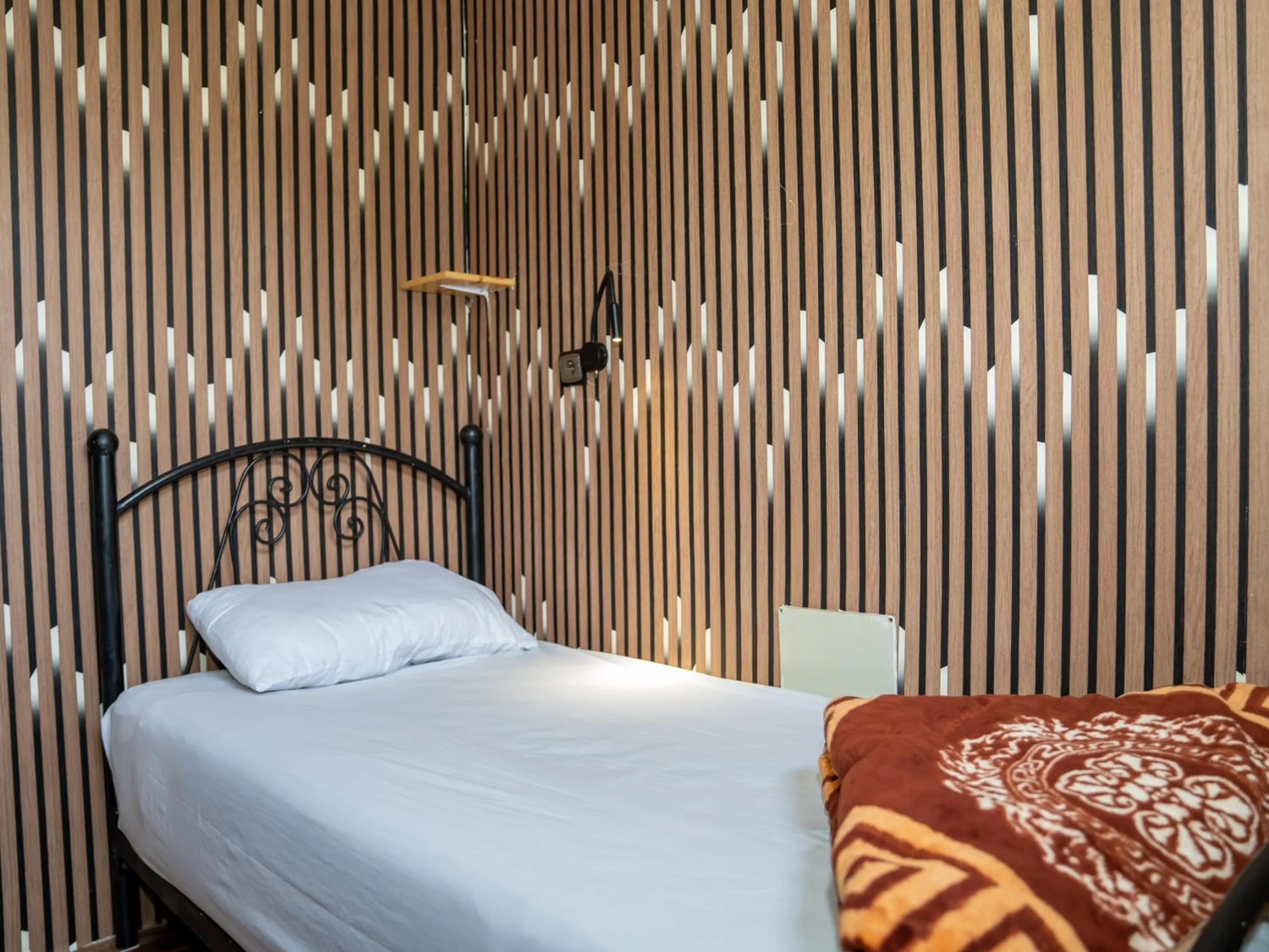 Bed in Dinosaur Anza Surf House