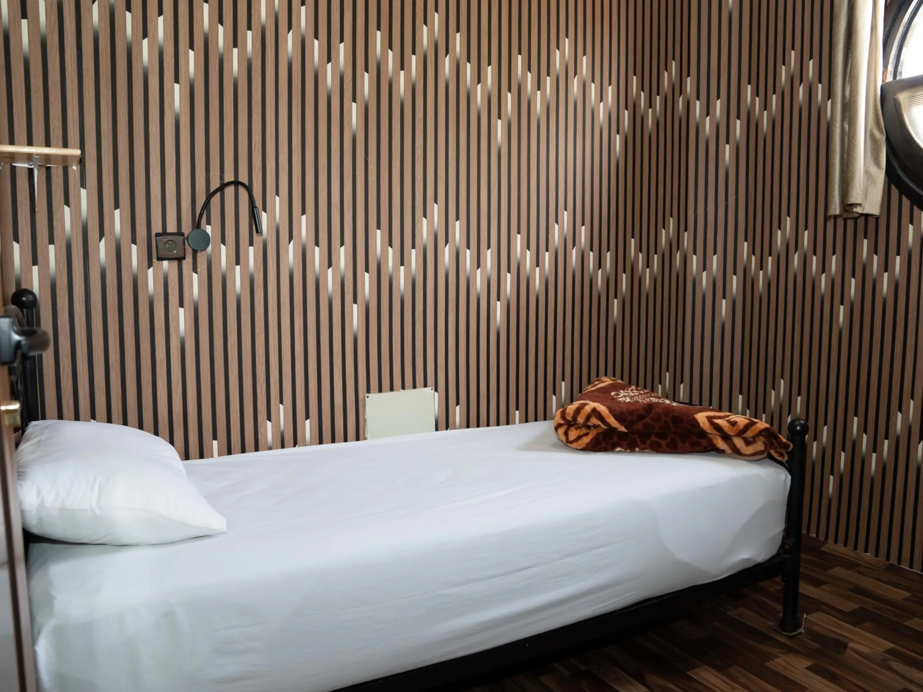 Bed in Dinosaur Anza Surf House