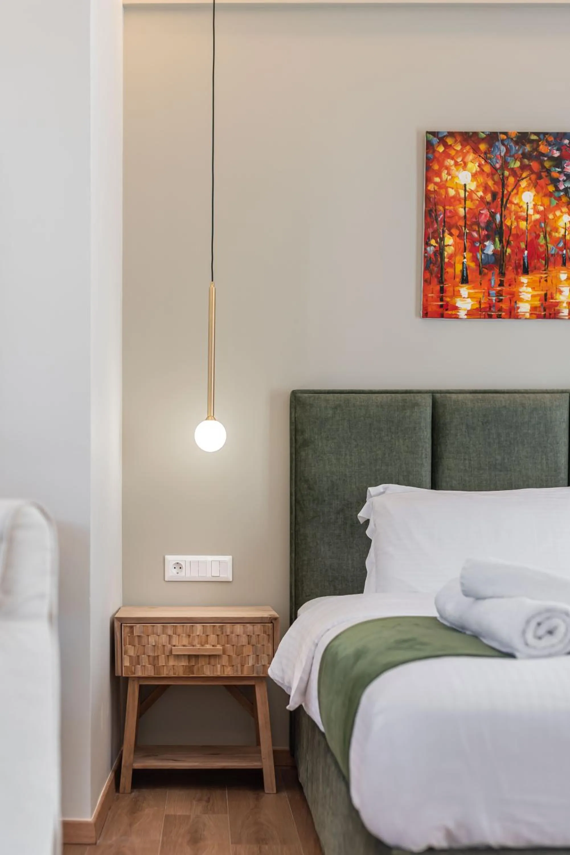 Bed in Acropolis Divine Apartments