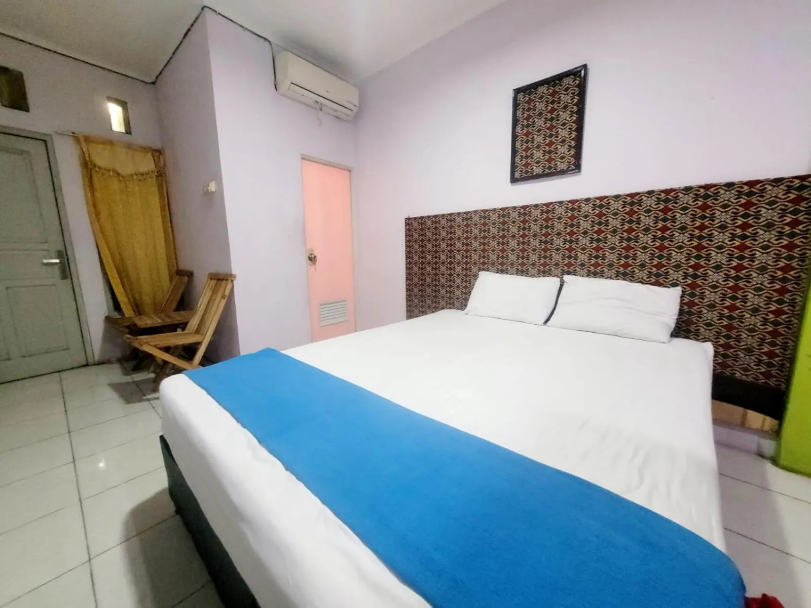 Bedroom in Wisma Gahalta by Fans