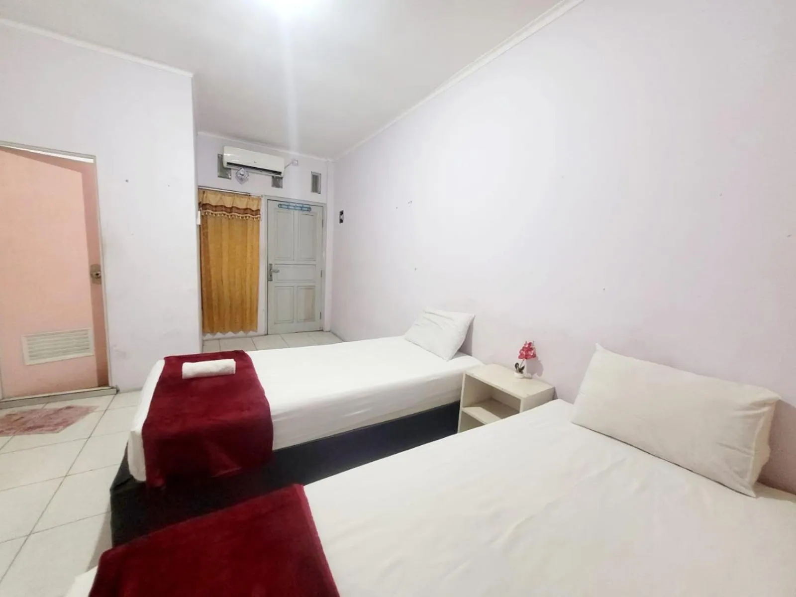 Bed in Wisma Gahalta by Fans