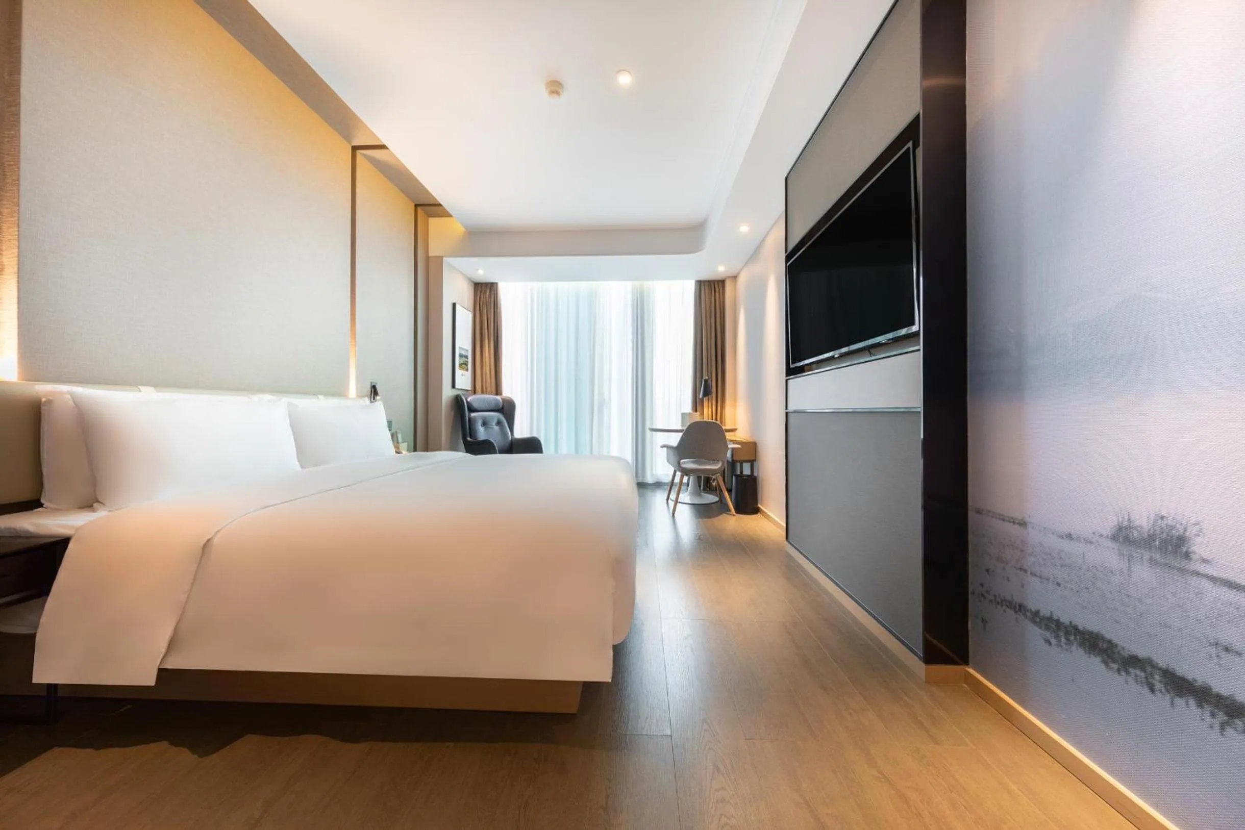 Bed in Atour Hotel Ningbo Sanjiangkou Bund Book City