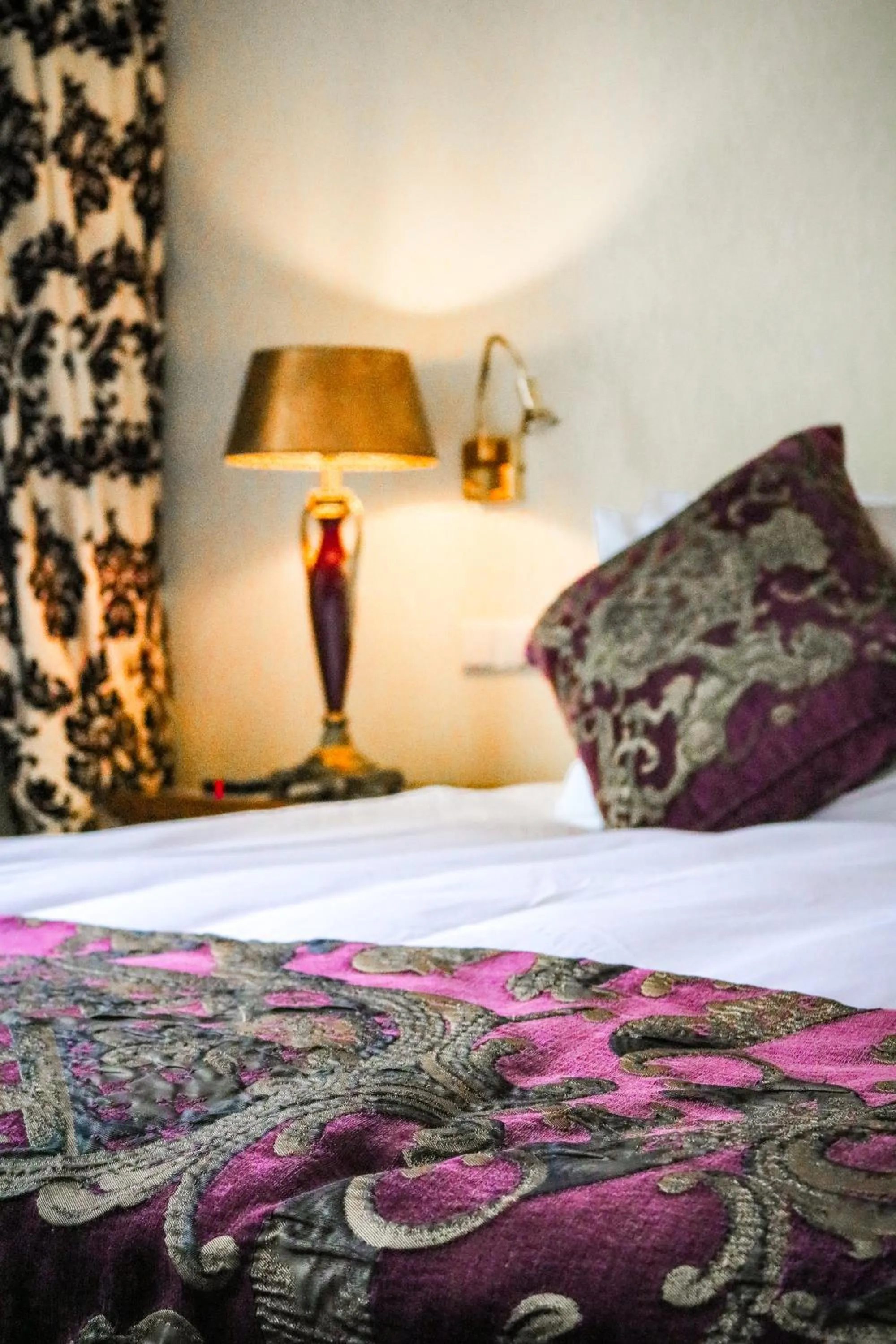 Bed in Ambassade Hotel