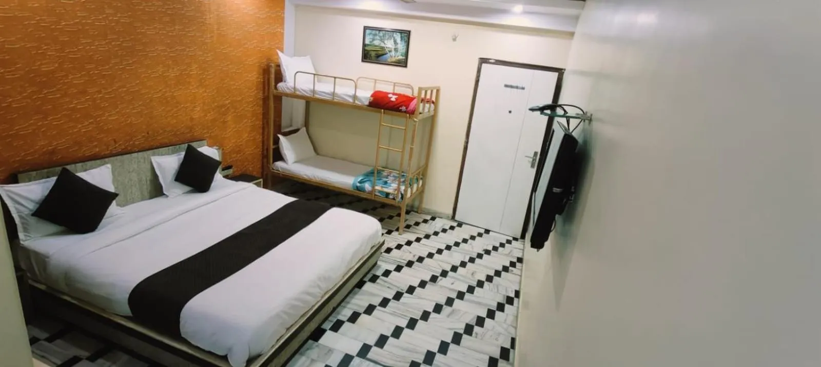 Bed in HOTEL HAYAT RESIDENCY