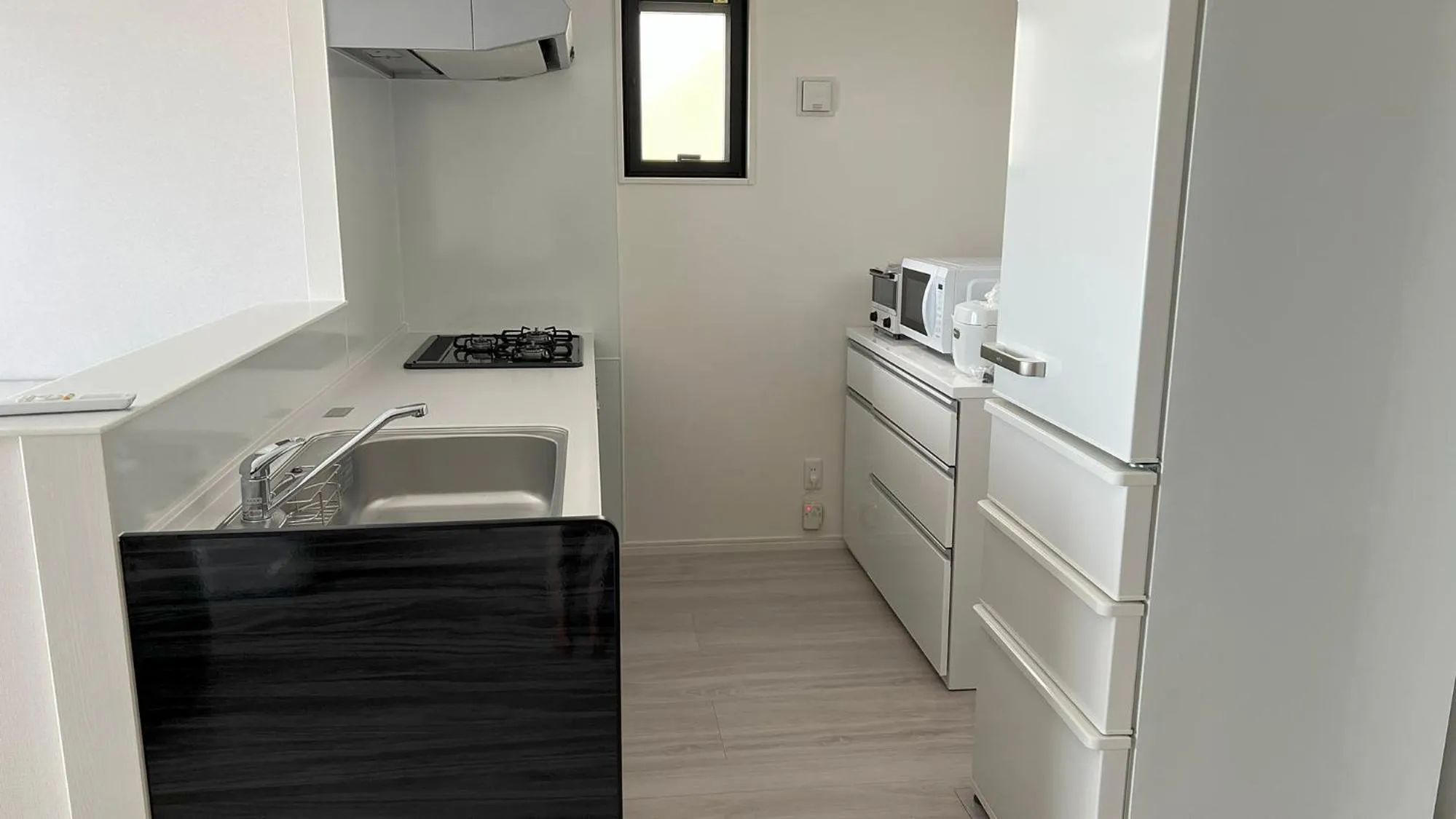 Kitchen or kitchenette in ＆Monde. Okinawa Arena Condominium