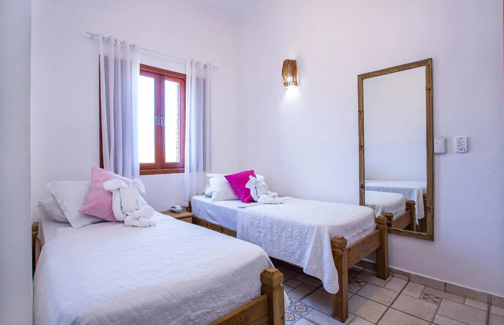 Quarto Duplo Econômico Sem Varanda in Pousada Vila Barequeçaba Quarto Duplo Econômico Sem Varanda in Pousada Vila Barequeçaba