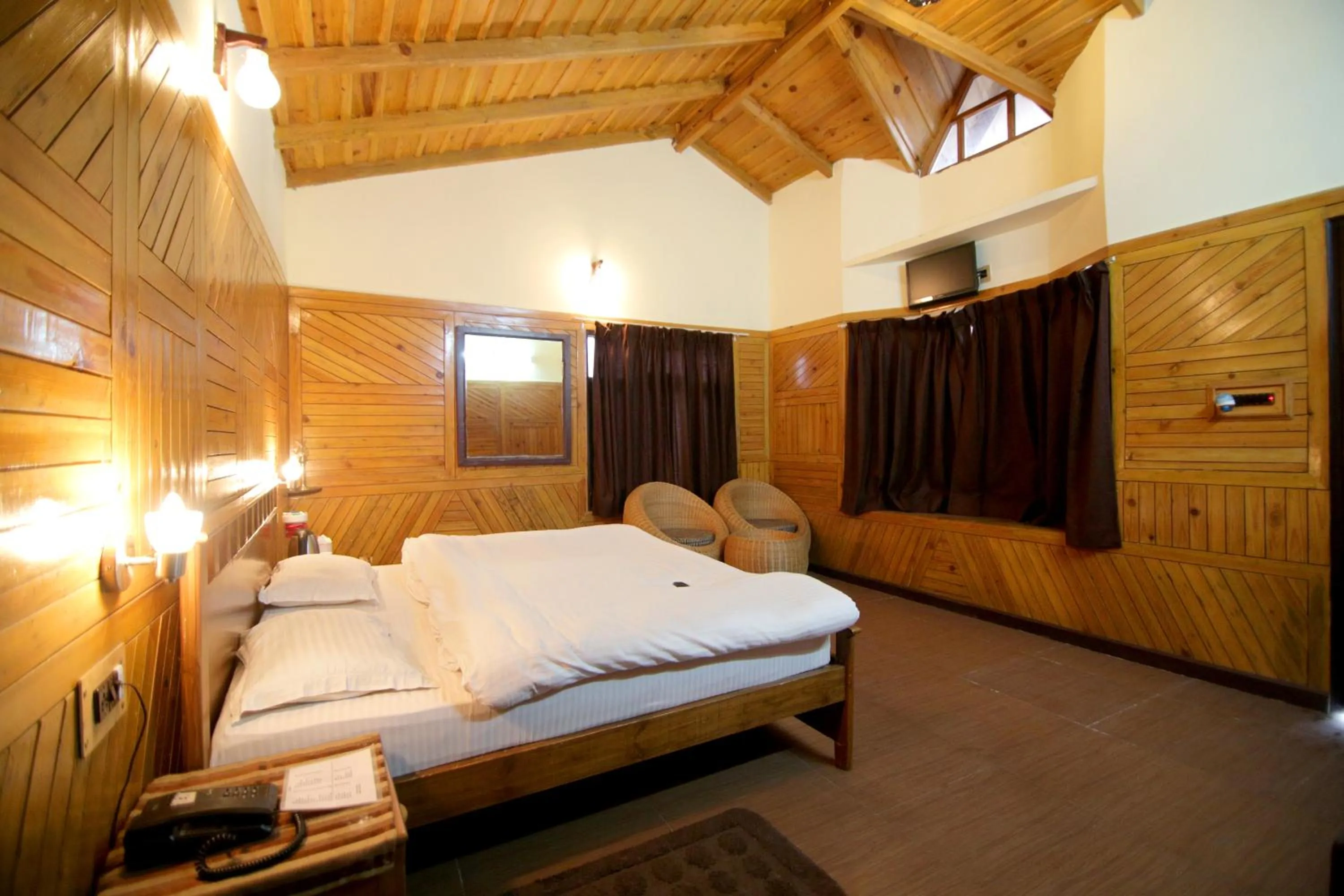 Bedroom in Ashoka Naini Chalet