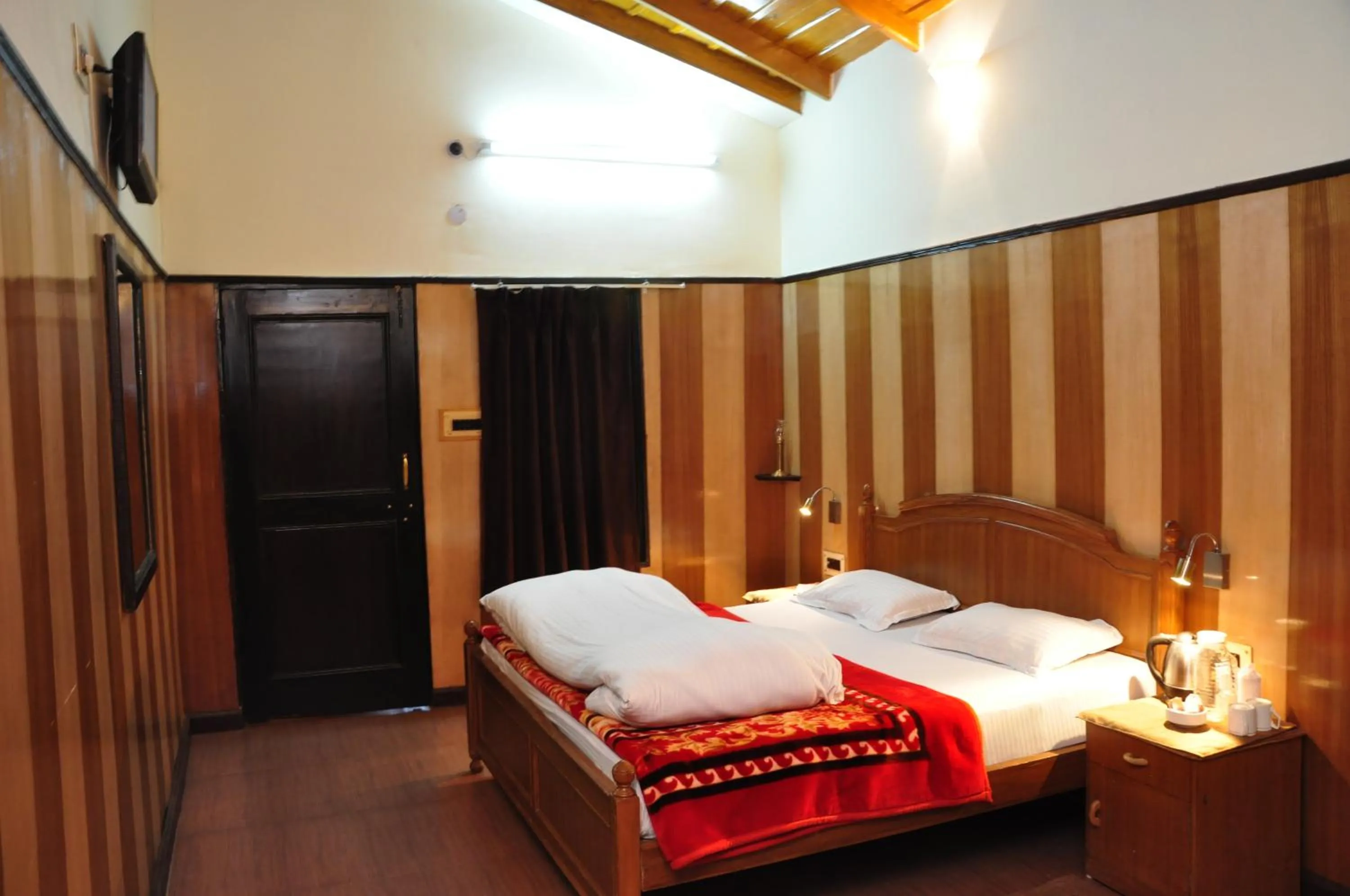 Bedroom in Ashoka Naini Chalet