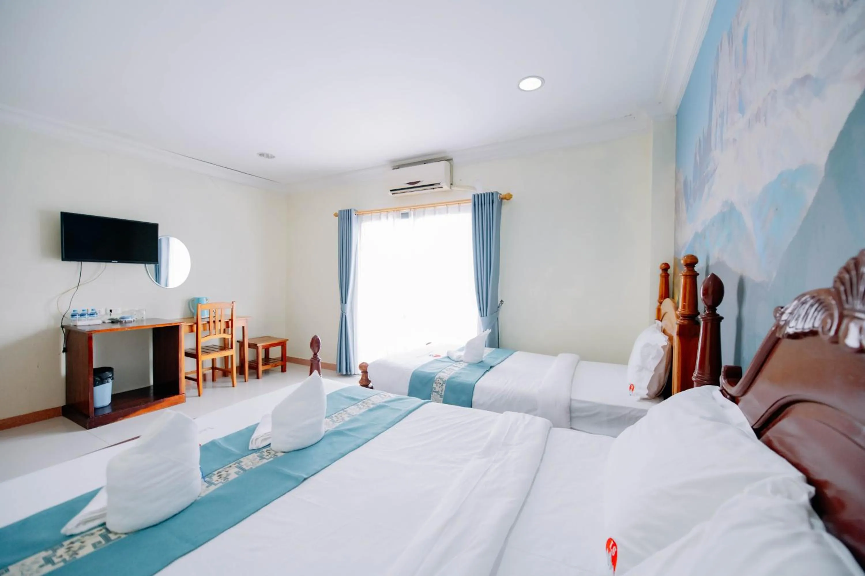 Bed in Lisha Roungnakhone Hotel