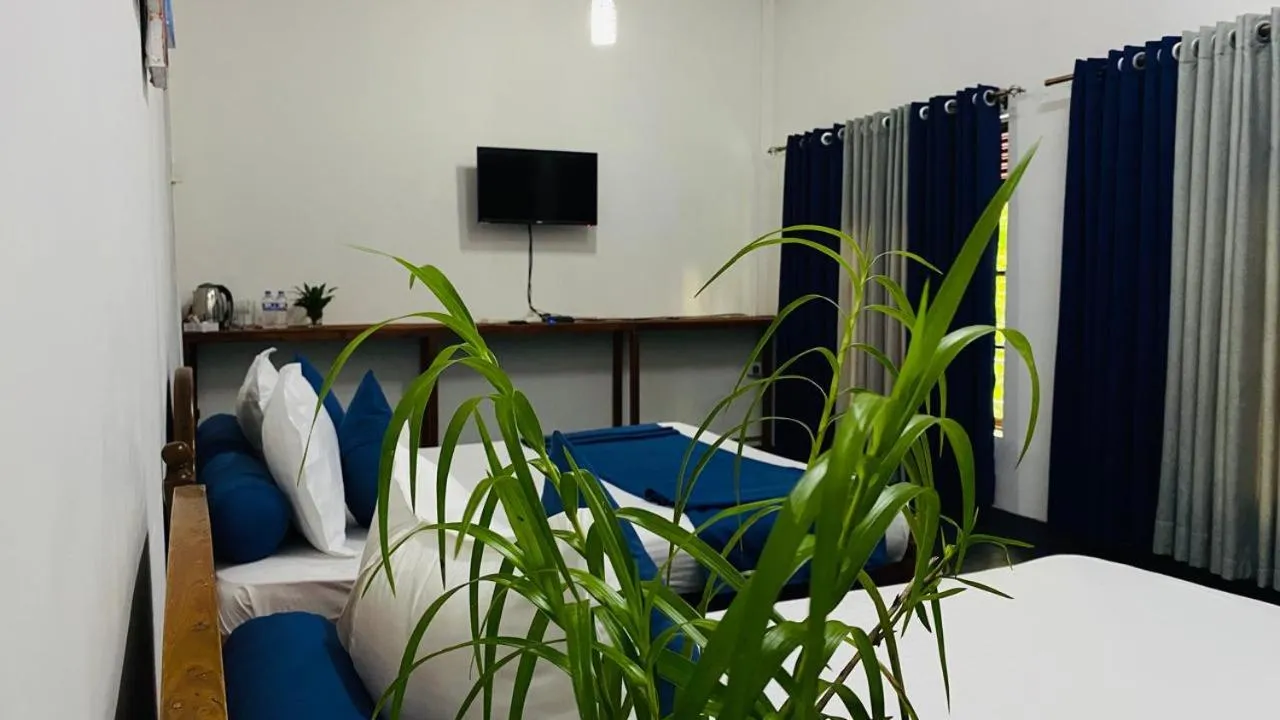 Communal lounge/ TV room in TEARAMB HOLIDAY BUNGALOW