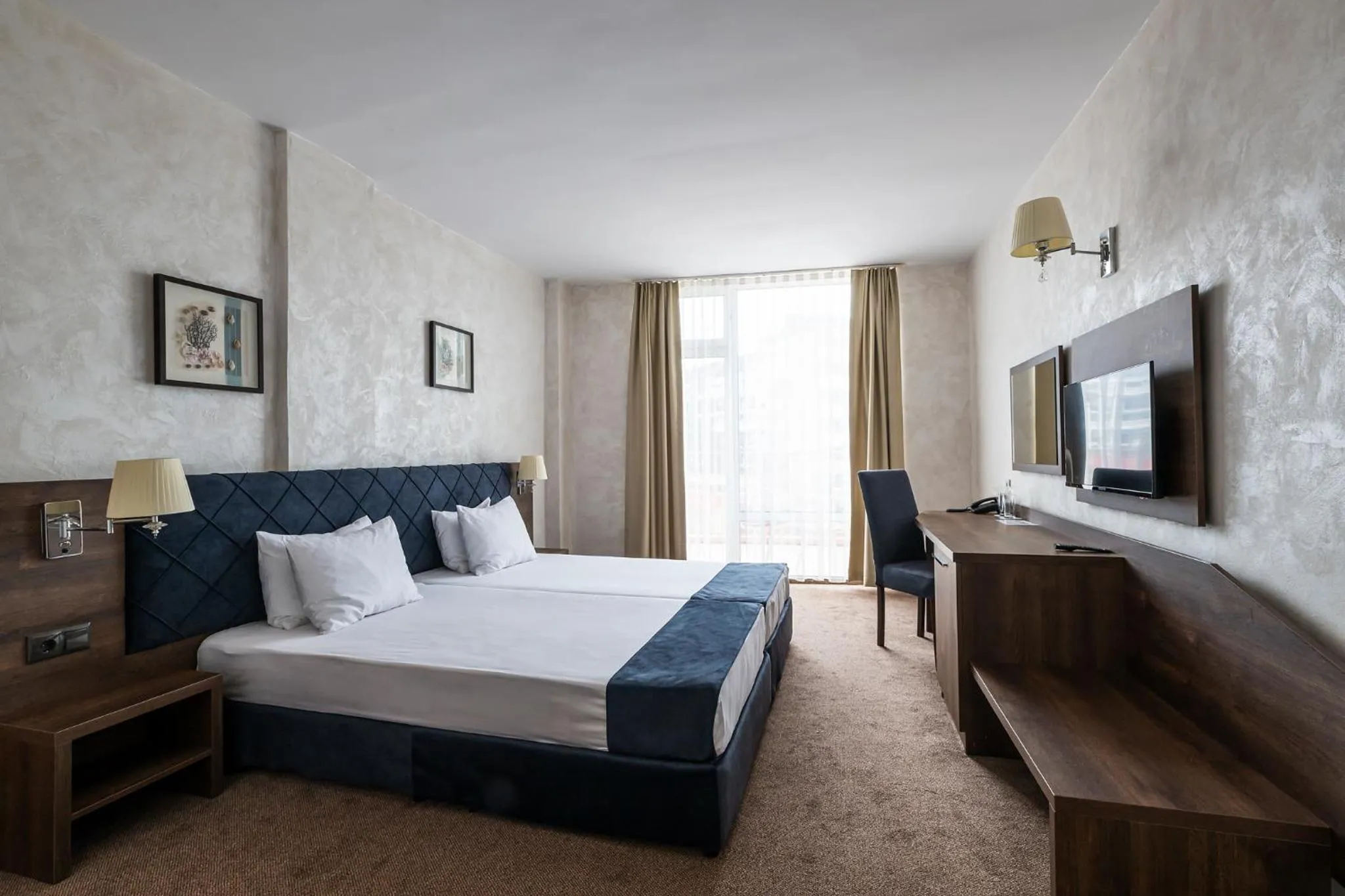 Bed in Flamingo Beach Hotel