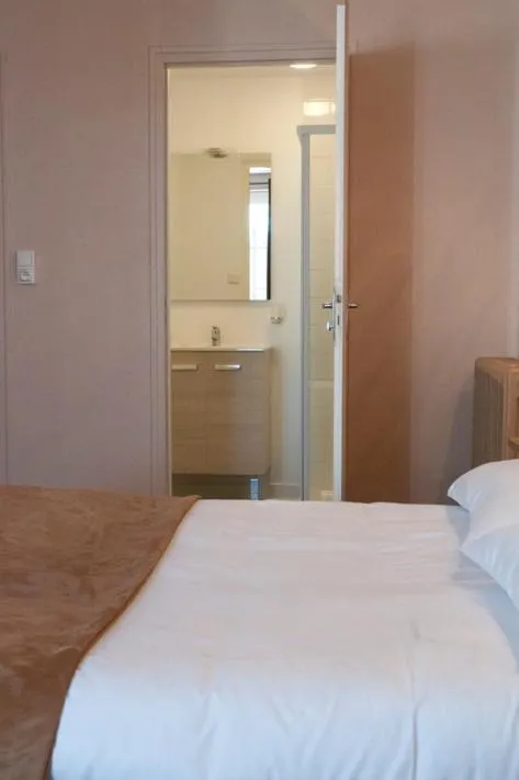 Bed in Hôtel des Pyrénées